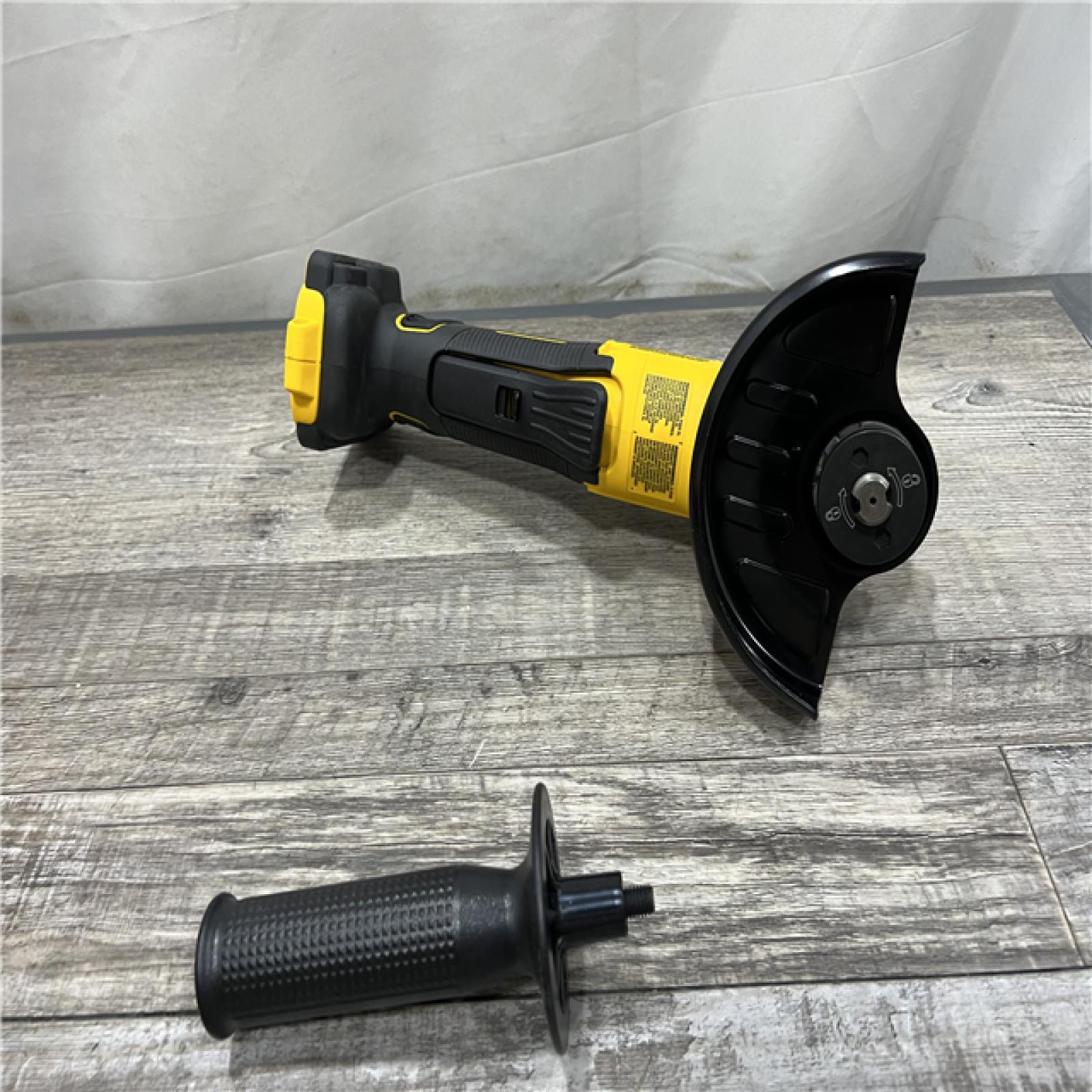 AS-IS DEWALT 20V MAX Cordless Brushless 4.5 - 5 in. Paddle Switch Angle Grinder with FLEXVOLT ADVANTAGE (Tool Only)