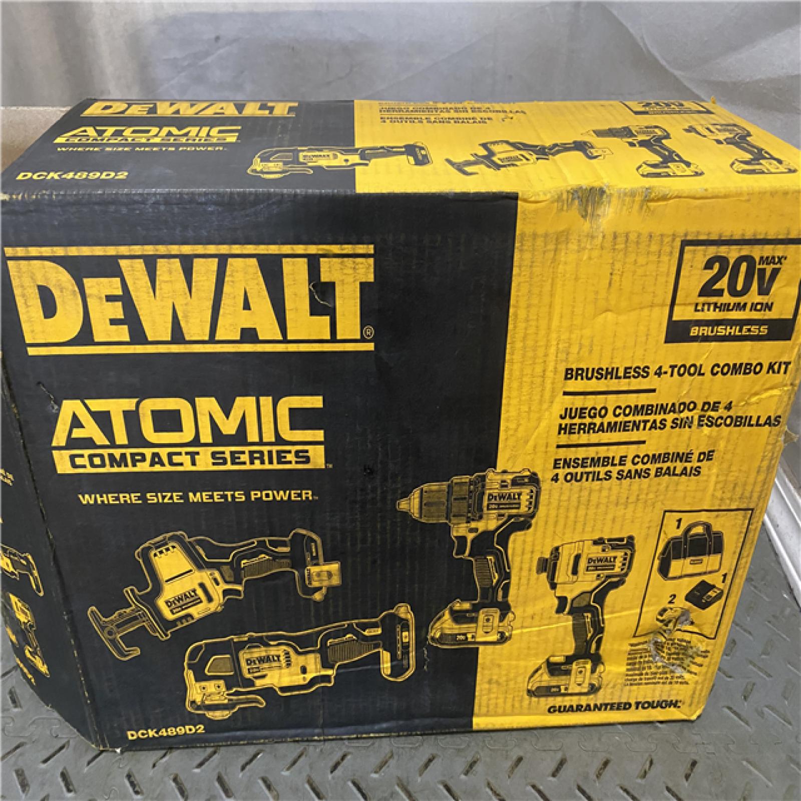 Houston location AS-IS DEWALT ATOMIC 20V MAX Cordless Brushless 4 Tool Combo Kit, (2) 2.0Ah Batteries, Charger, and Bag