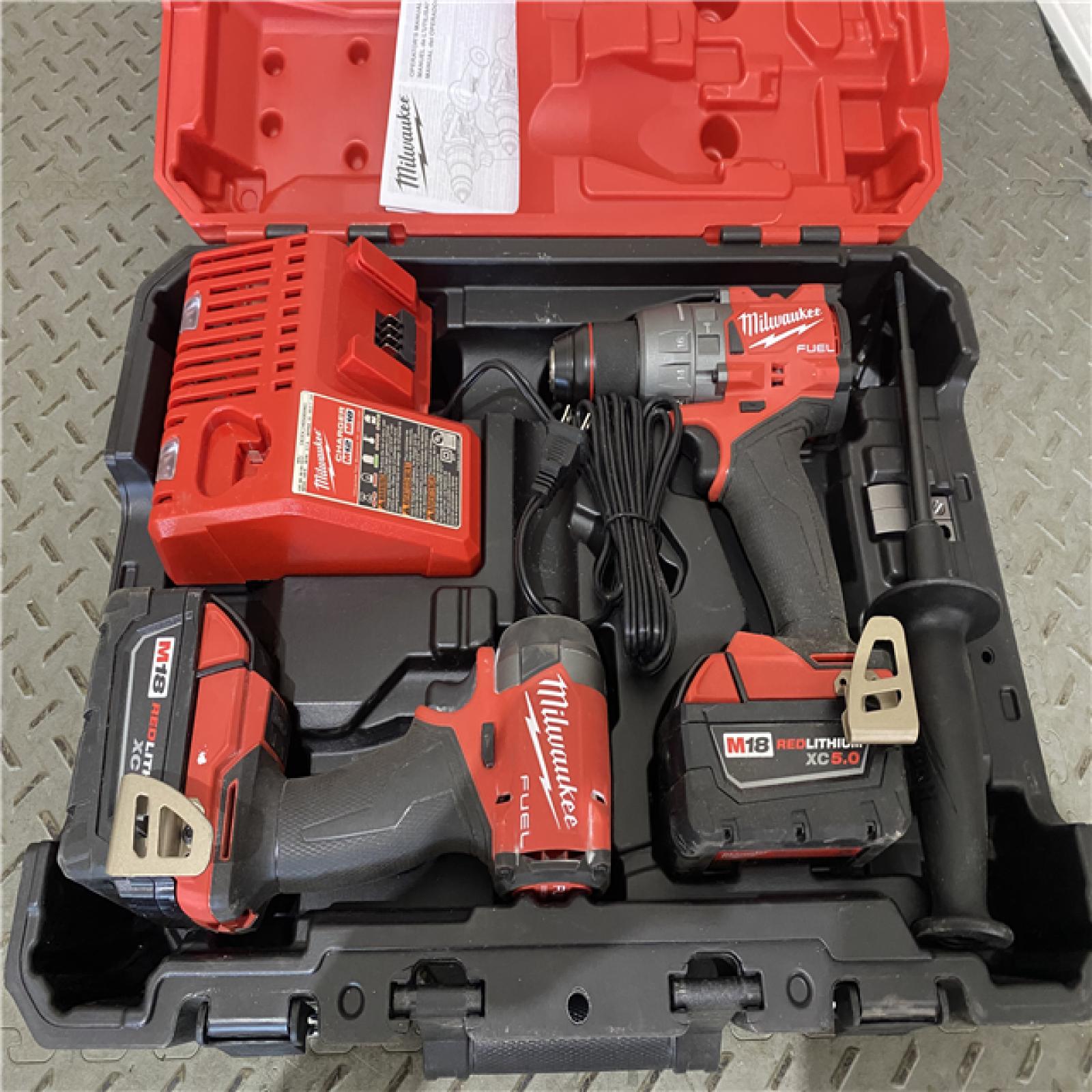 Houston location AS-IS Milwaukee 3697-22 M18 FUEL 1/2 Hammer Driller/Driver &1/4 Hex Impact Driver 2 Tool Combo Kit