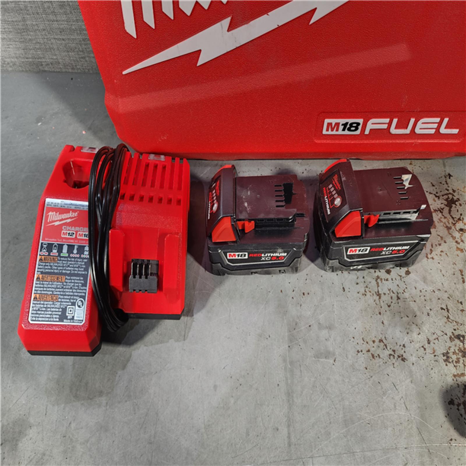 HOUSTON LOCATION - AS-IS Milwaukee M18 FUEL 18V Lithium-Ion Brushless Cordless Hammer Drill and Impact Driver Combo Kit (2-Tool) with 2 Batteries