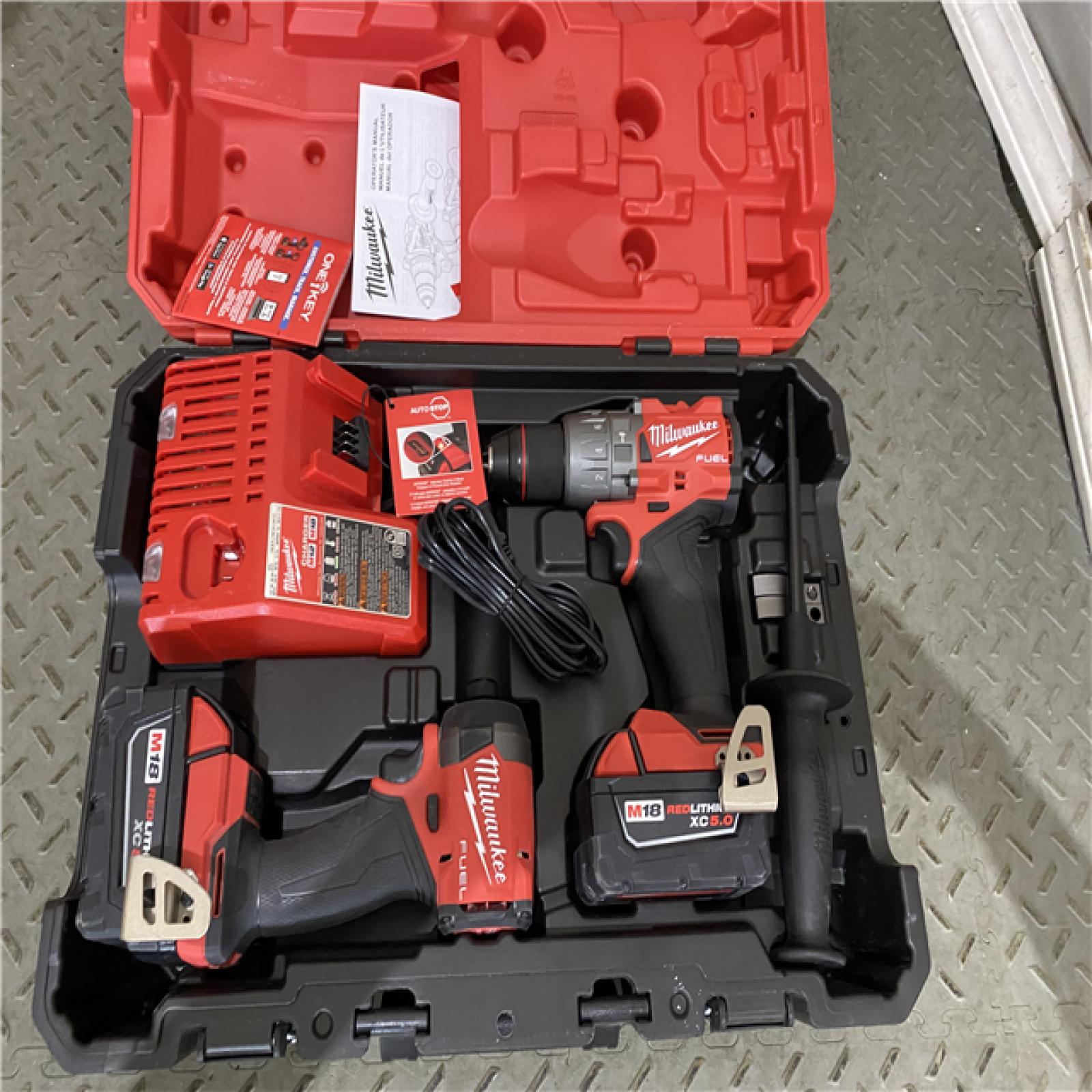 Houston location AS-IS Milwaukee 3697-22 M18 FUEL 1/2 Hammer Driller/Driver &1/4 Hex Impact Driver 2 Tool Combo Kit