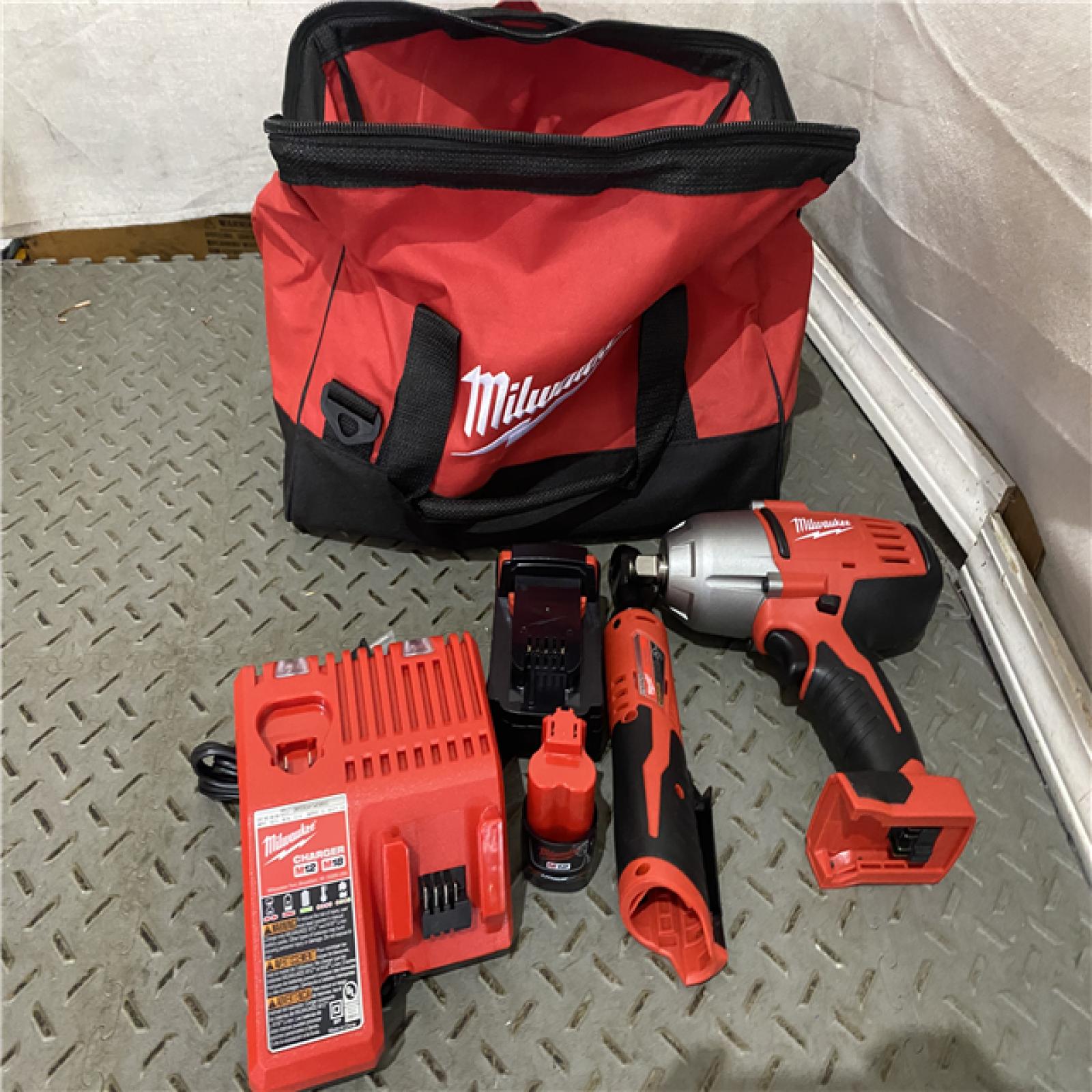 Houston location AS-IS MILWAUKEE M18/M12 12/18V Lithium-Ion Cordless 3/8 in. Ratchet and 1/2 in. Impact Wrench with Friction Ring Combo Kit