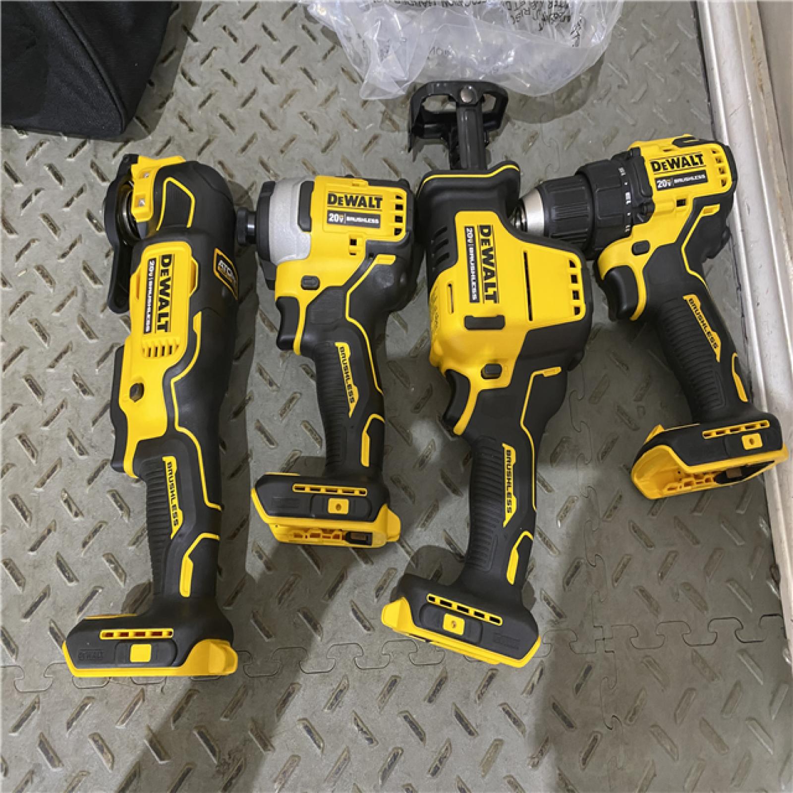 Houston location AS-IS DEWALT ATOMIC 20V MAX Cordless Brushless 4 Tool Combo Kit, (2) 2.0Ah Batteries, Charger, and Bag