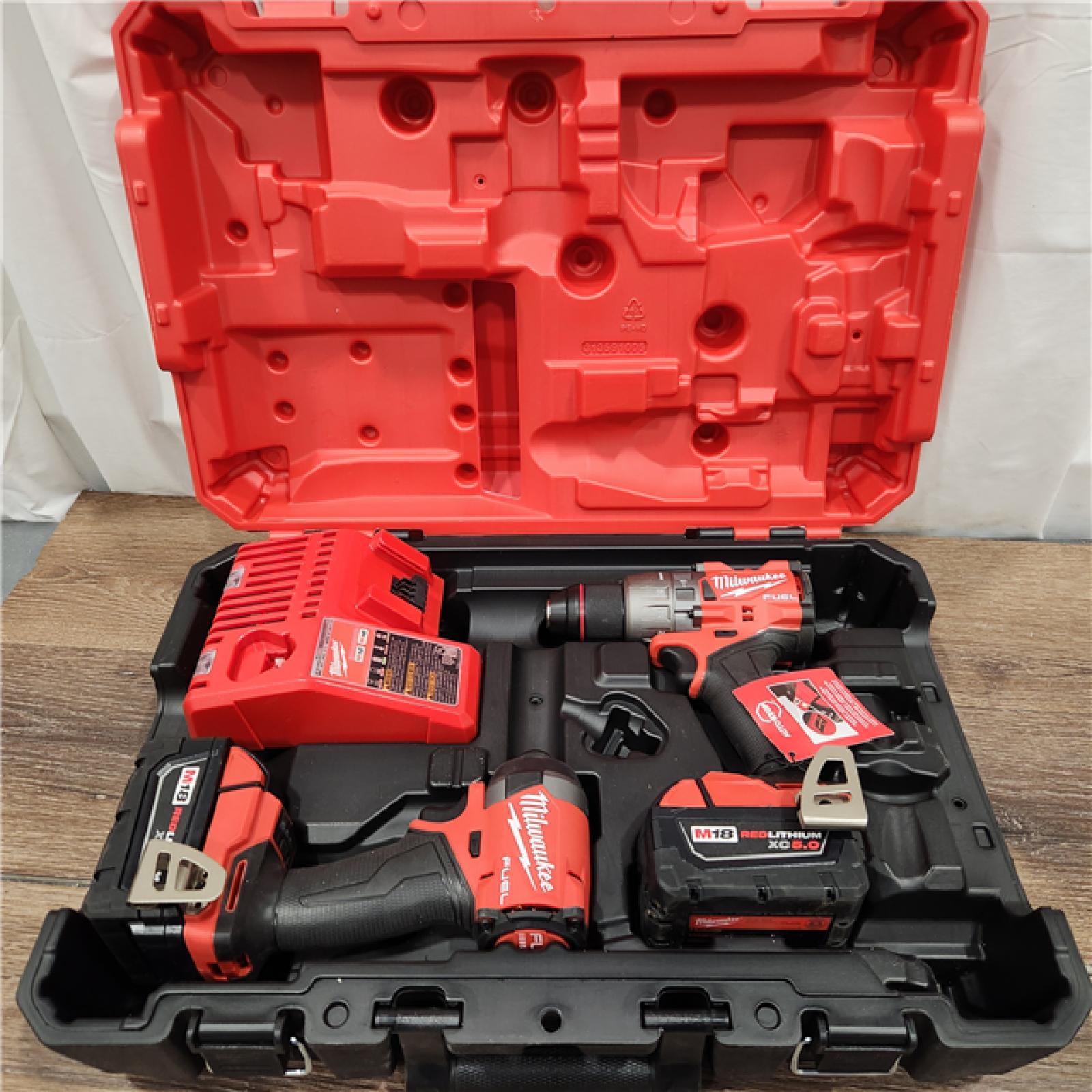 AS-IS Milwaukee M18 FUEL 18V Lithium-Ion Brushless Cordless Hammer Drill and Impact Driver Combo Kit (2-Tool) with 2 Batteries