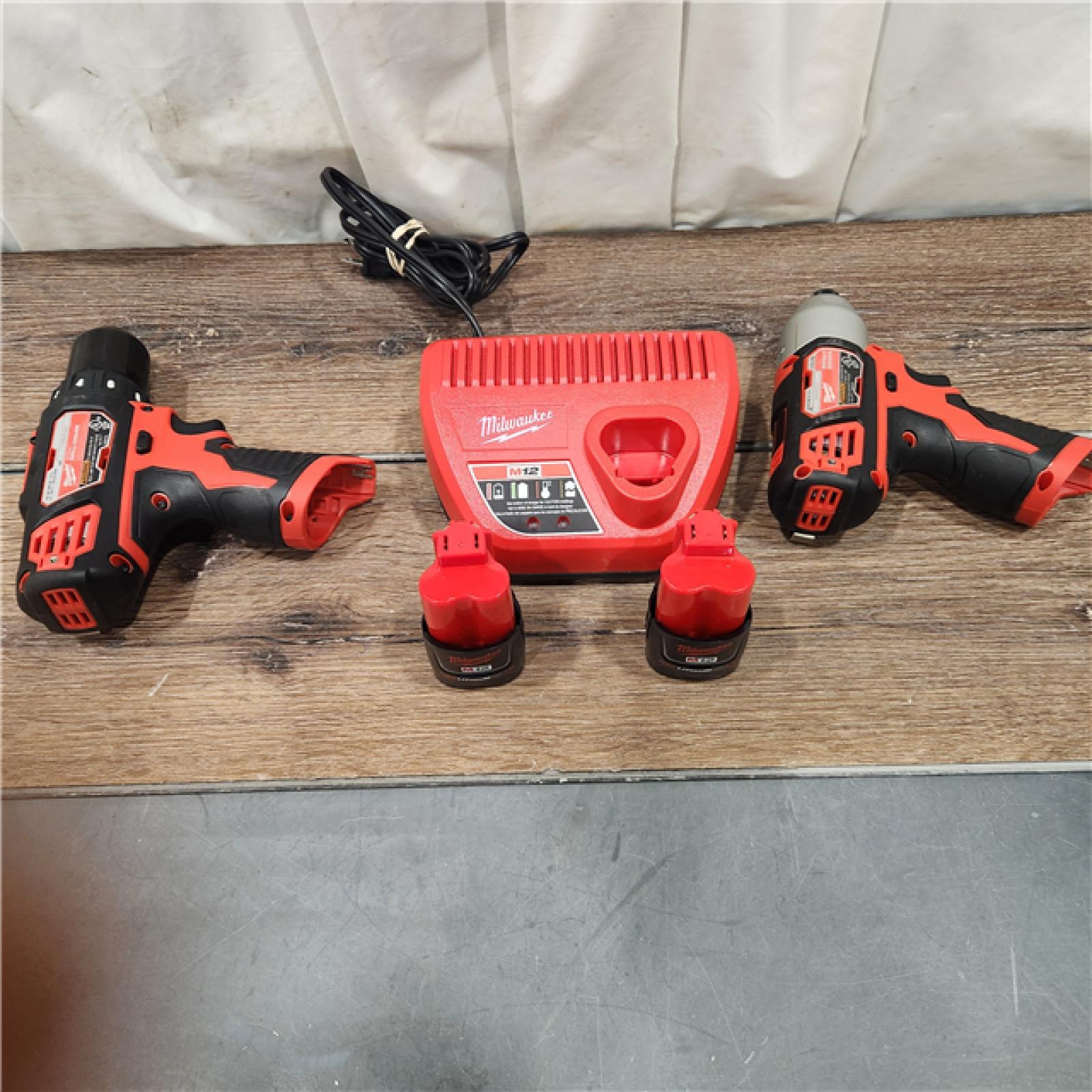 AS-IS Milwaukee 2494-22 M12 Cordless Combination 3/8  Drill / Driver and 1/4  Hex Impact Driver Dual Power Tool Kit (2 Lithium Ion Batteries  Charger  and B