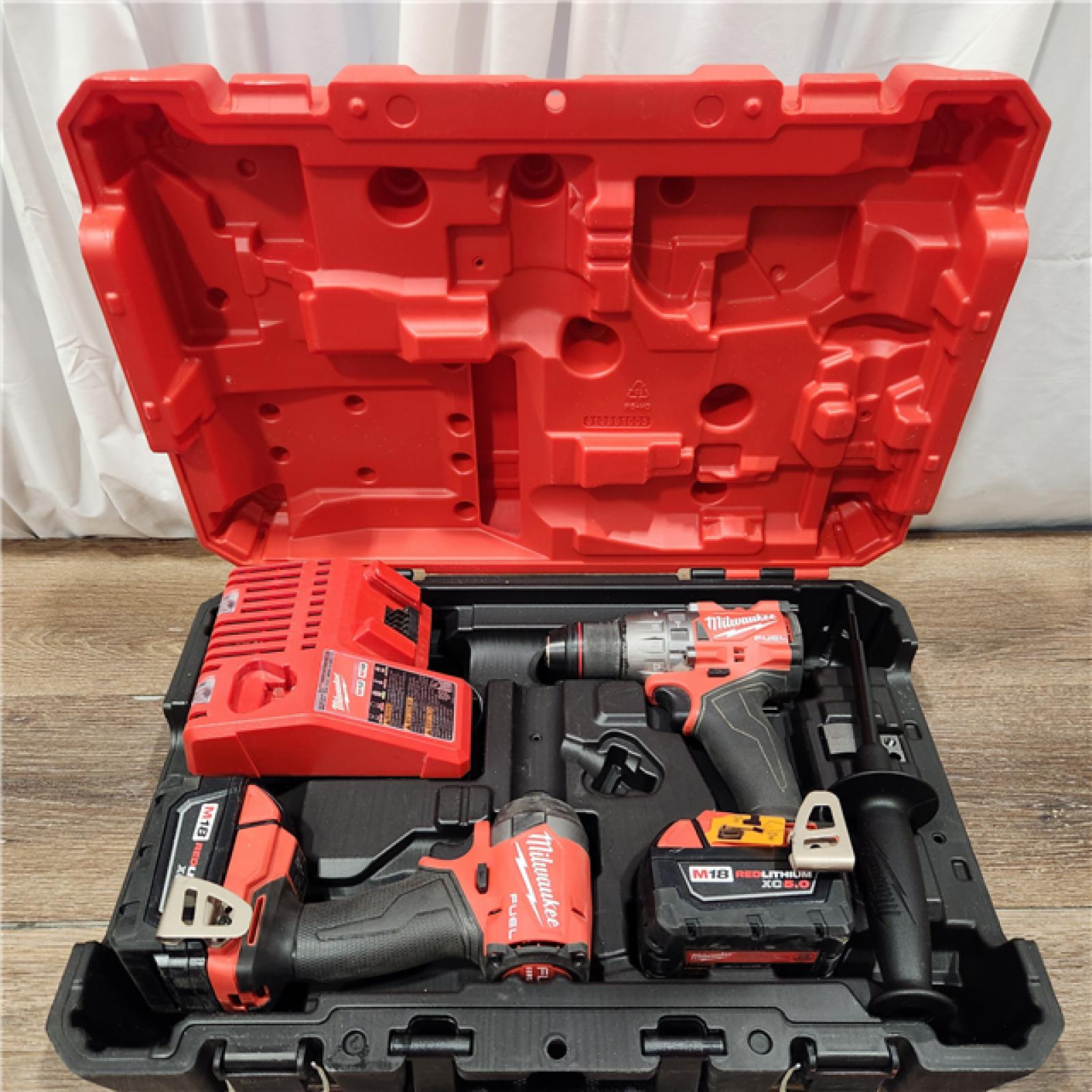 AS-IS Milwaukee M18 FUEL 18V Lithium-Ion Brushless Cordless Hammer Drill and Impact Driver Combo Kit (2-Tool) with 2 Batteries