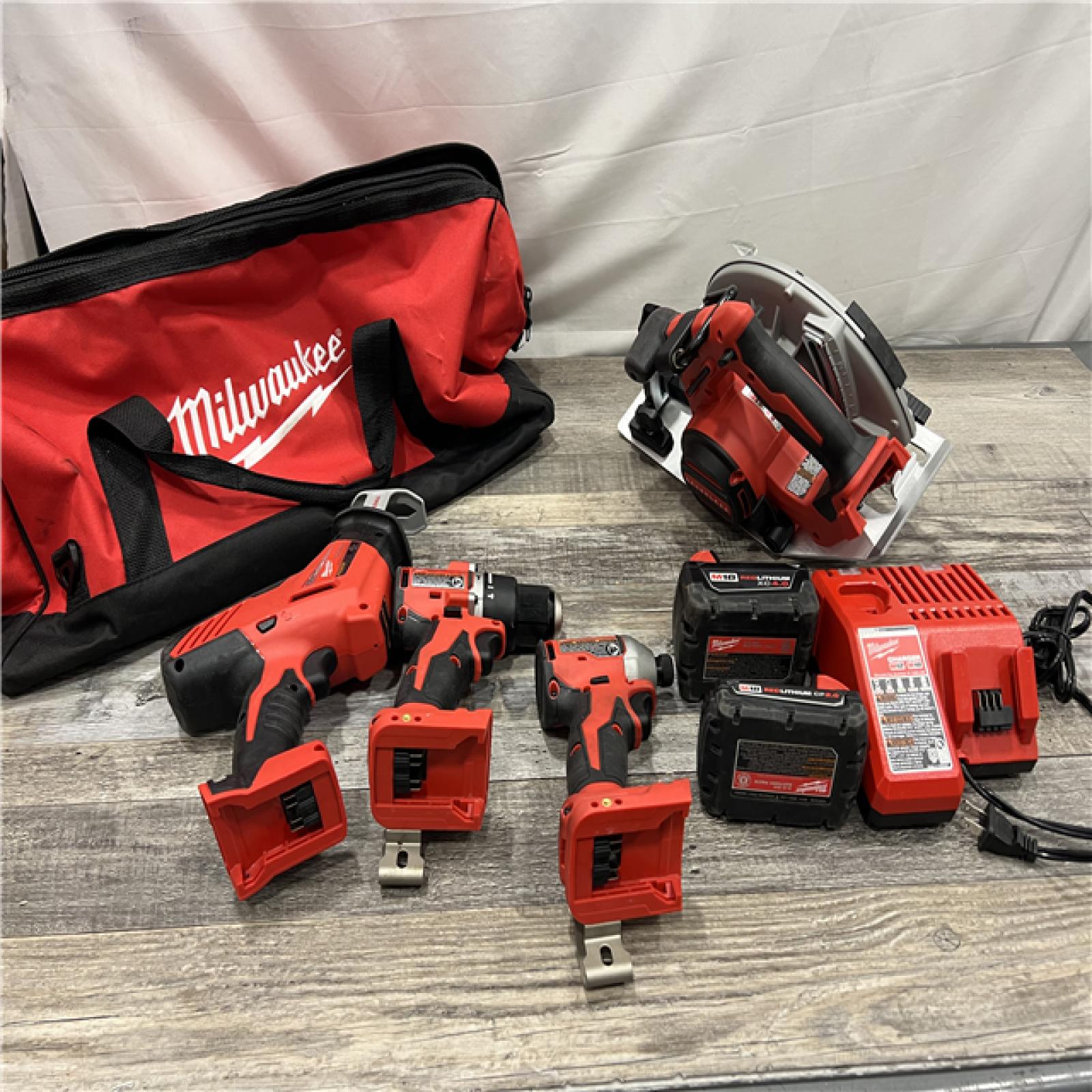 AS-IS MILWAUKEE M18 18-Volt Lithium-Ion Brushless Cordless Combo Kit (4-Tool) with 2-Batteries, 1-Charger and Tool Bag