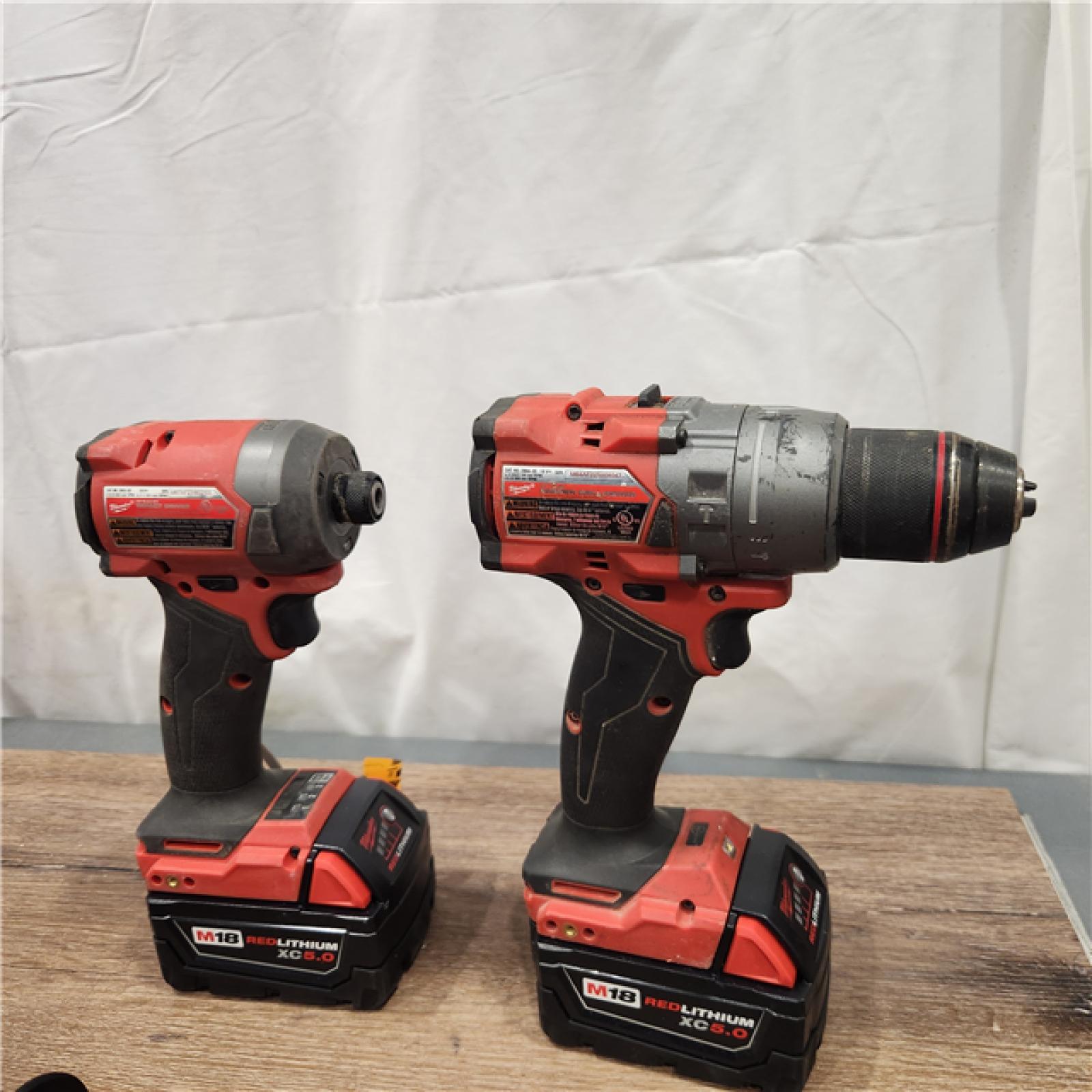 AS-IS Milwaukee M18 FUEL 18V Lithium-Ion Brushless Cordless Hammer Drill and Impact Driver Combo Kit (2-Tool) with 2 Batteries