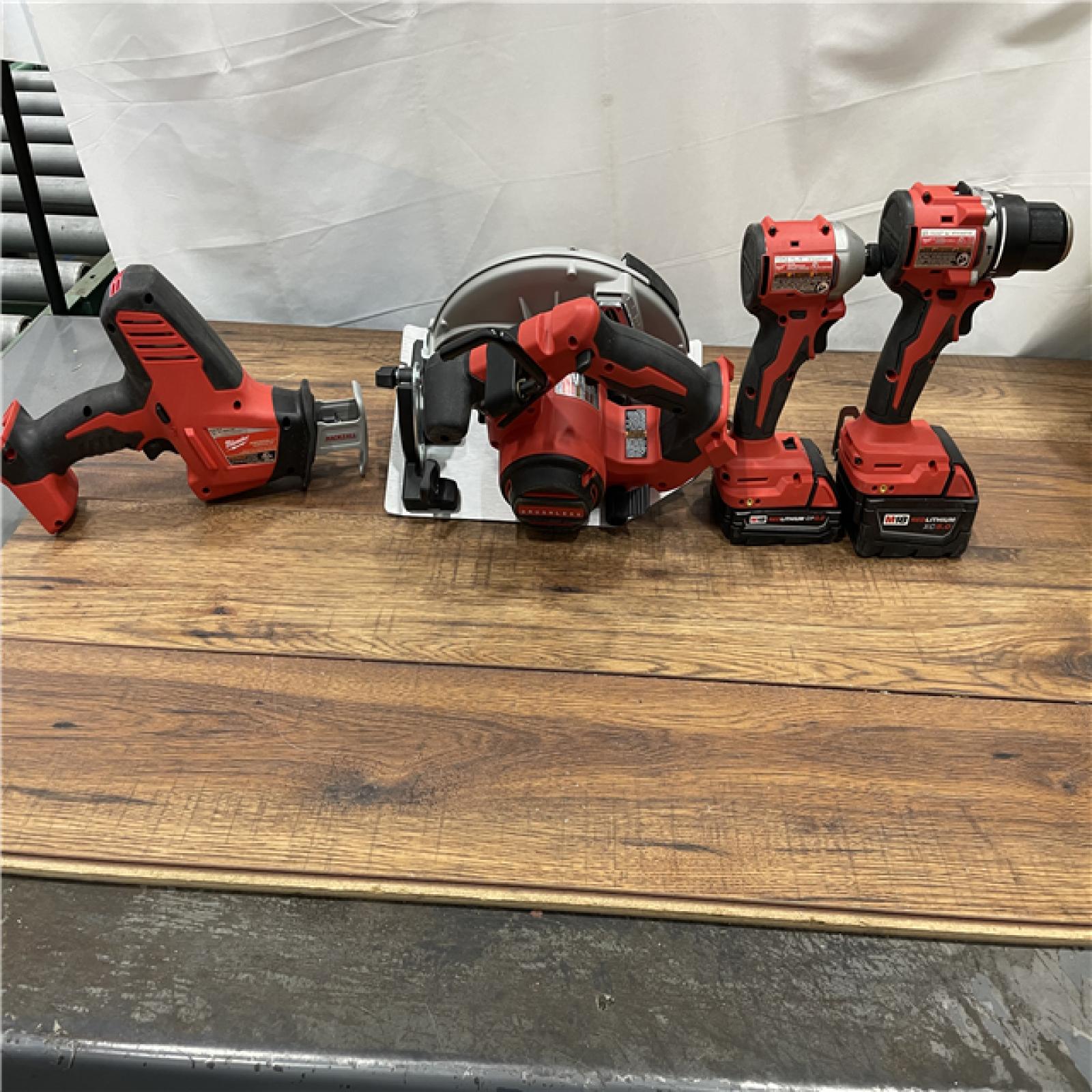 AS-IS Milwaukee M18 18-Volt Lithium-Ion Brushless Cordless Combo Kit (4-Tool)