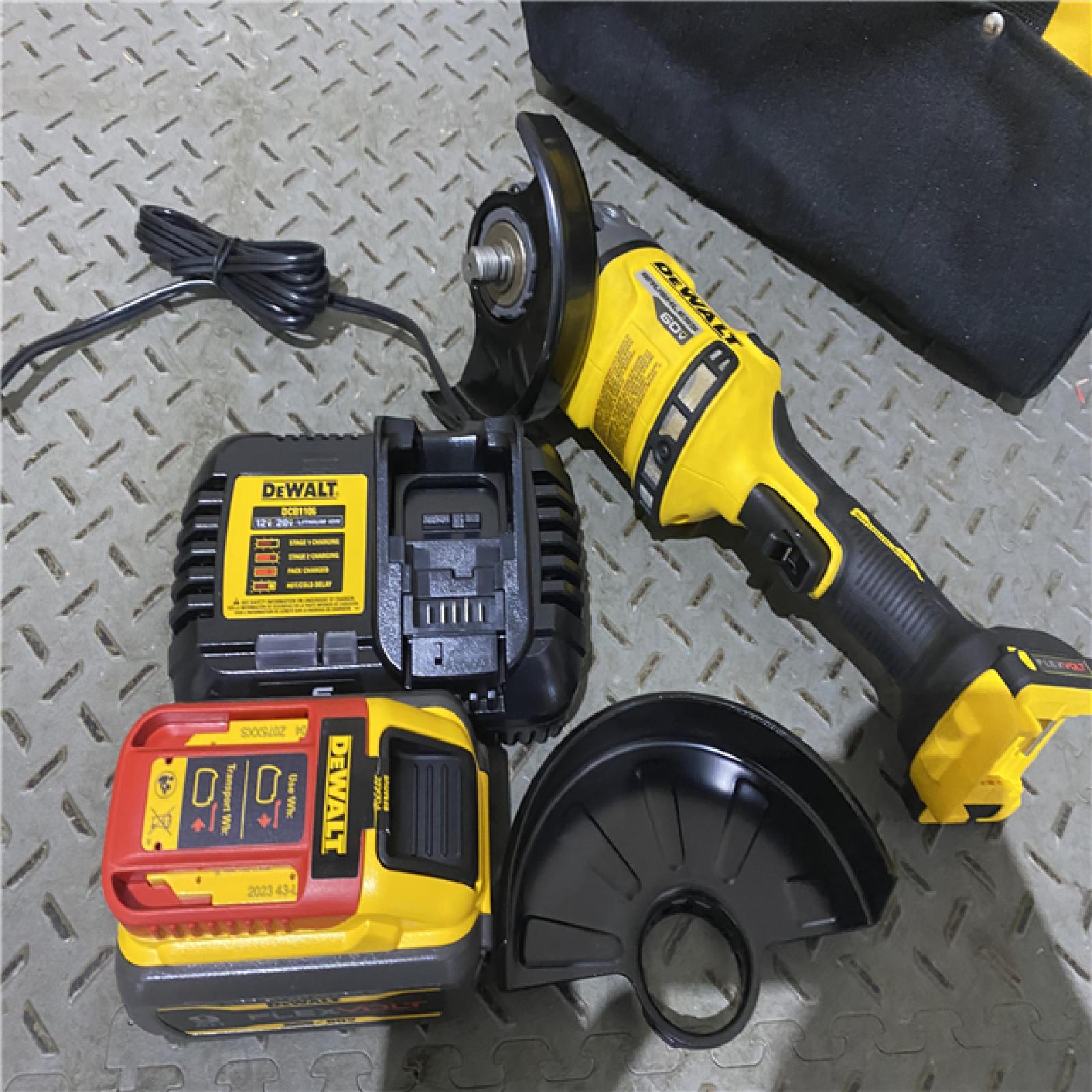 Houston location AS-IS DEWALT FLEXVOLT 60-Volt MAX Brushless 4-1/2 in. - 6 in. Cordless Grinder with Kickback Brake Kit (D)