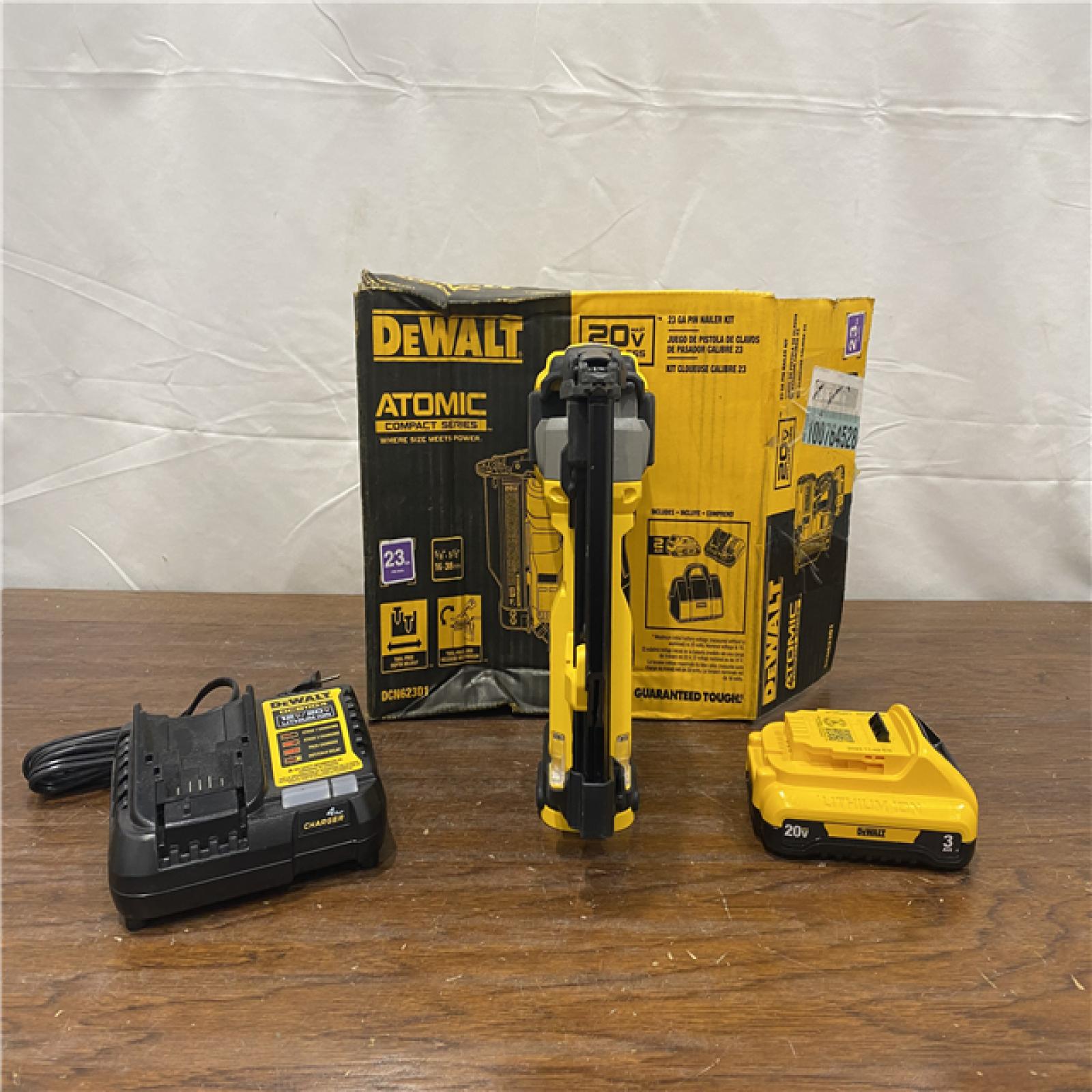 AS-IS DEWALT ATOMIC 20V MAX Lithium Ion Cordless 23 Gauge Pin Nailer Kit with 3.0Ah Battery and Charger