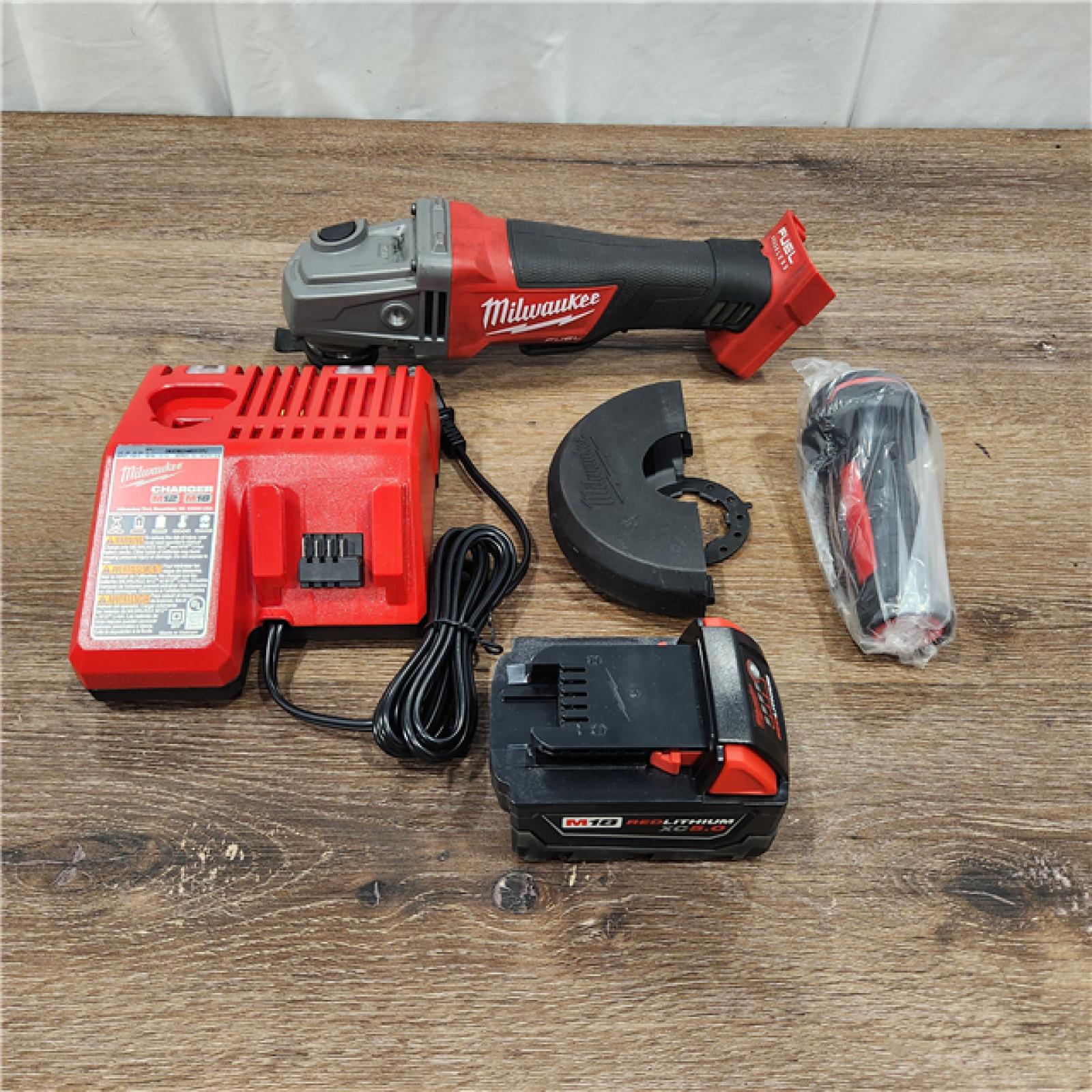AS-IS M18 FUEL 18-Volt Lithium-Ion Brushless Cordless 4-1/2 in. /5 in. Grinder W/ Paddle Switch Kit W/ (2) 5.0Ah Batteries