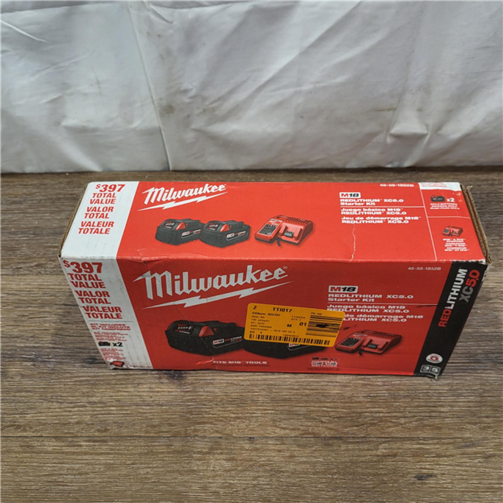 NEW! Milwaukee M18 18-Volt Lithium-Ion XC Starter Kit with Two 5.0Ah Batteries / Charger (48-59-1852B)