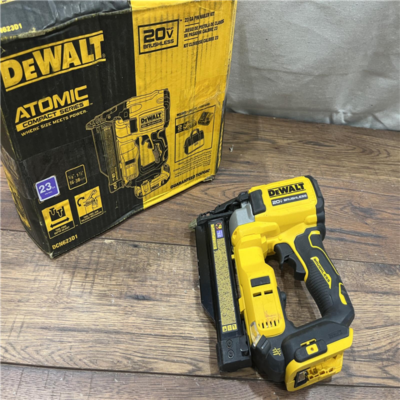 AS-IS DeWalt DCN623D1 20-Volt MAX Atomic Compact Cordless Pin Nailer Kit  Brushless Motor  23 Gauge  Battery - Quantity 1