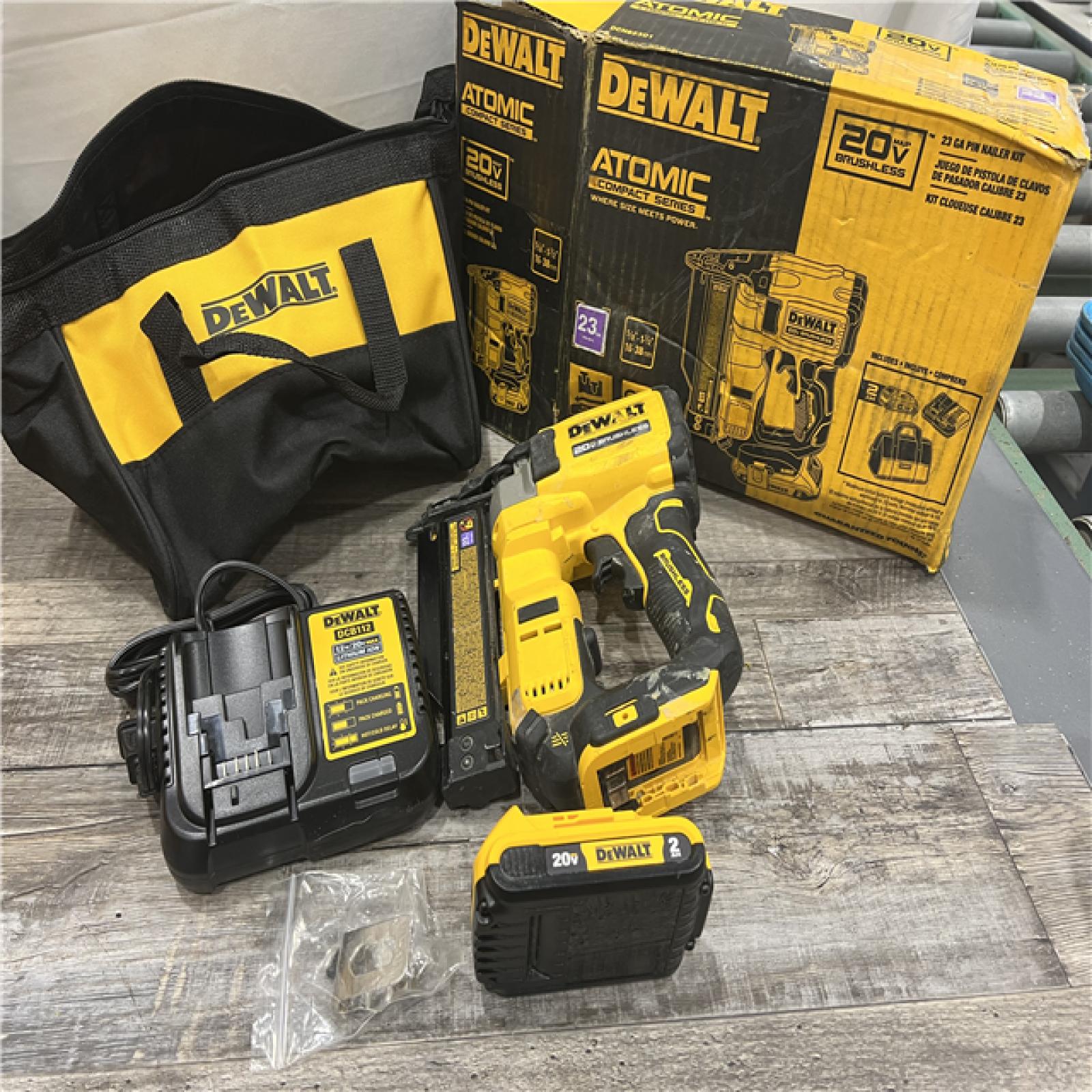 AS-IS DEWALT ATOMIC 20V MAX Lithium Ion Cordless 23 Gauge Pin Nailer Kit with 2.0Ah Battery and Charger