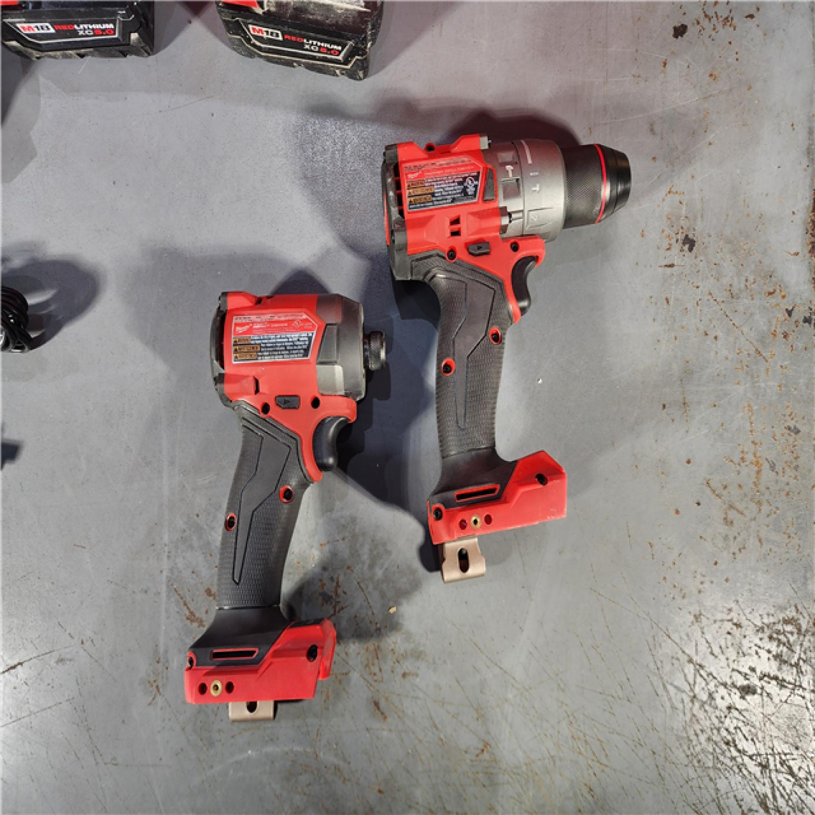 HOUSTON LOCATION - AS-IS Milwaukee M18 FUEL 18V Lithium-Ion Brushless Cordless Hammer Drill and Impact Driver Combo Kit (2-Tool) with 2 Batteries