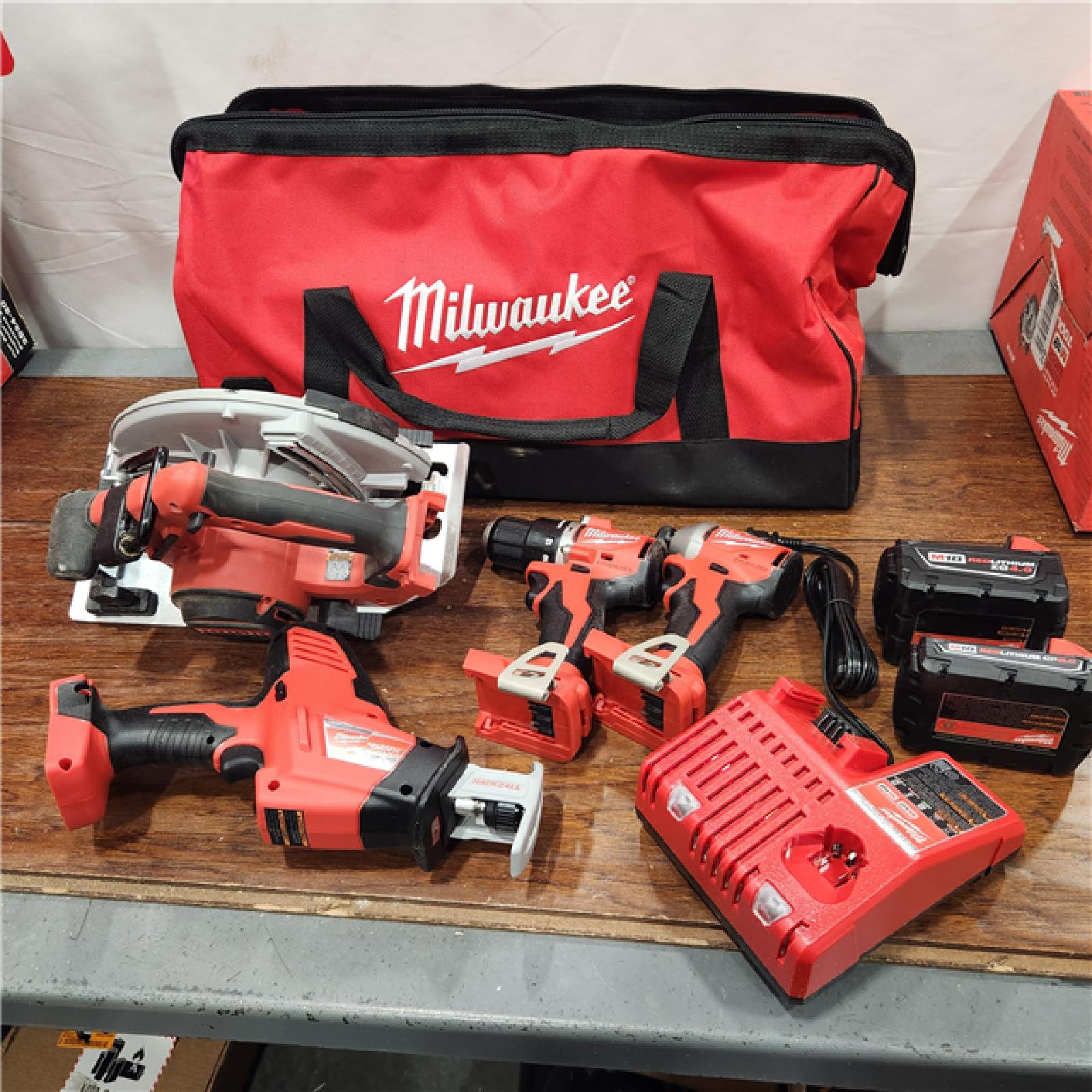 AS-IS M18 18-Volt Lithium-Ion Brushless Cordless Combo Kit (4-Tool) with 2-Batteries, 1-Charger and Tool Bag