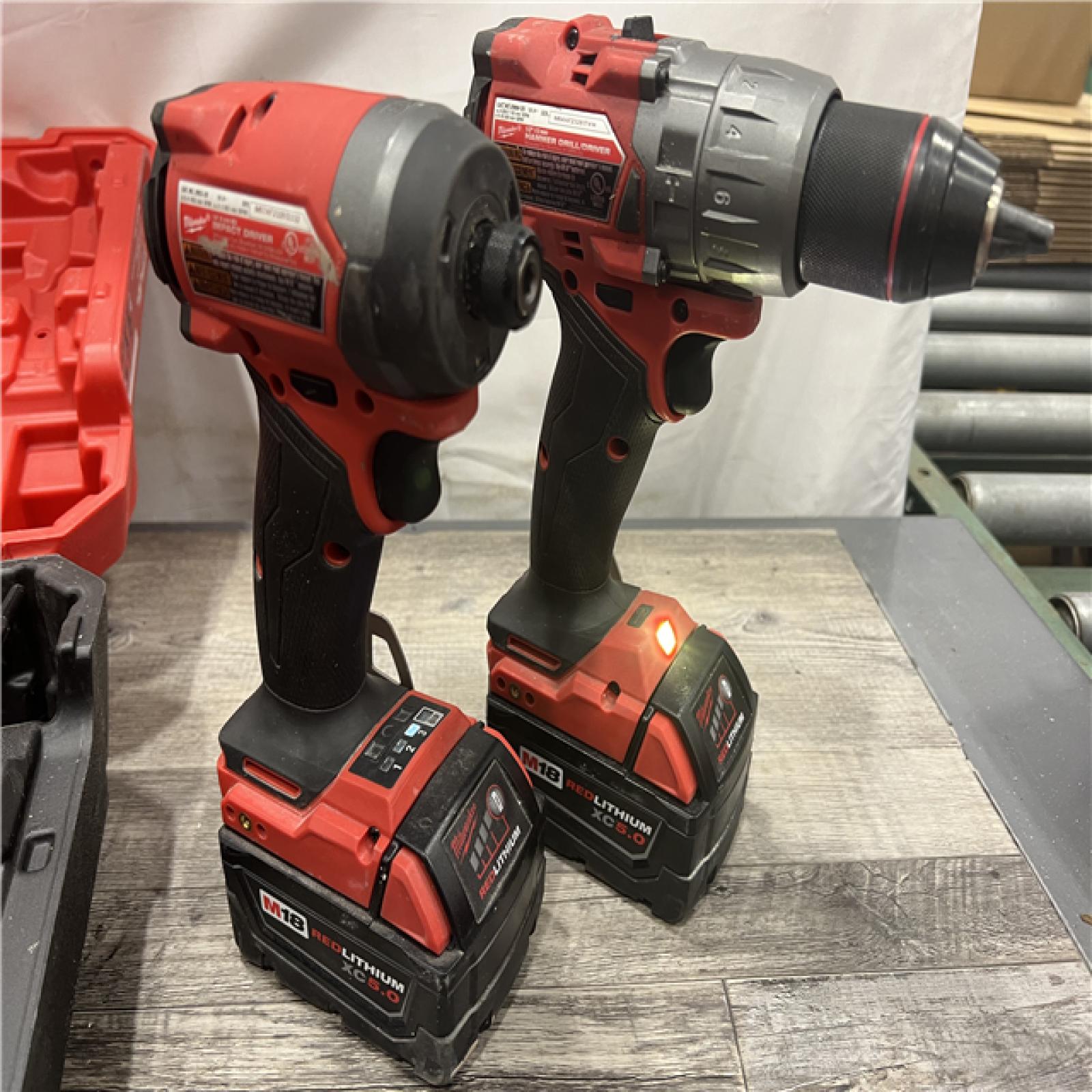 AS-IS MILWAUKEE M18 FUEL 18V Lithium-Ion Brushless Cordless Hammer Drill and Impact Driver Combo Kit (2-Tool) with 2 Batteries