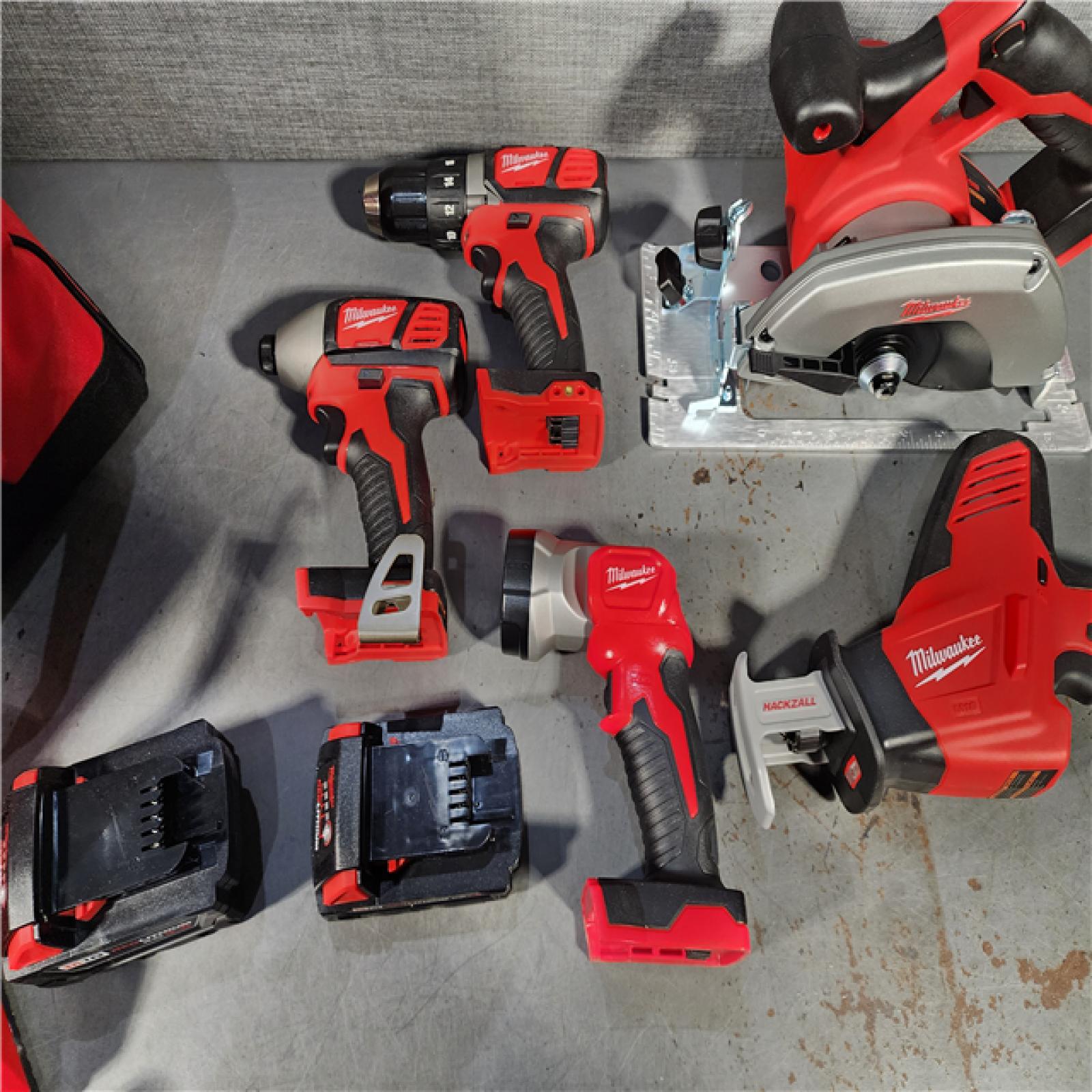 HOUSTON LOCATION - AS-IS (APPEARS LIKE NEW) Milwaukee M18 18-Volt Lithium-Ion Cordless Combo Tool Kit (5-Tool) with (1) 3.0Ah and (1) 1.5Ah Battery, (1) Charger, (1) Tool Bag