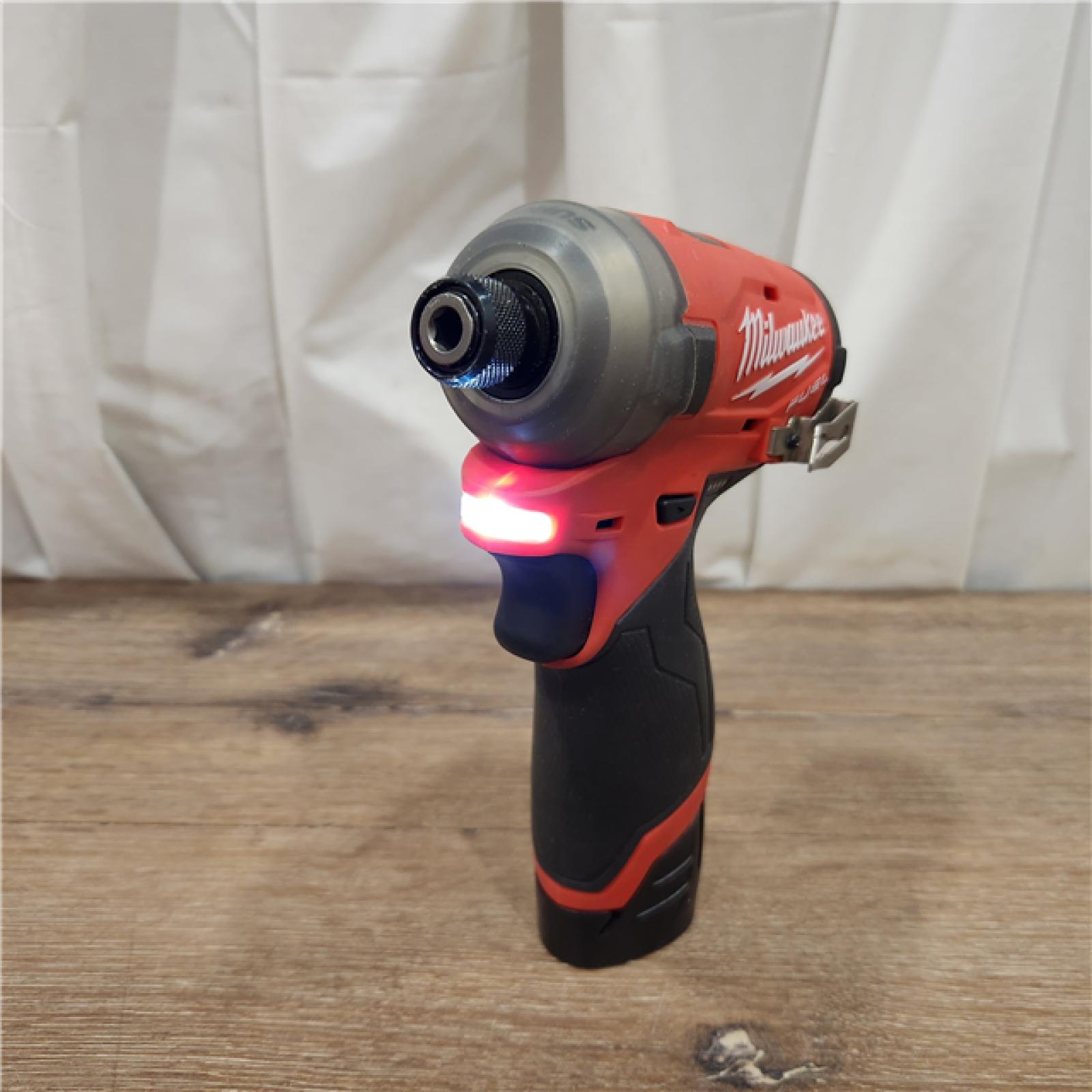 AS-IS M12 FUEL SURGE 12V Lithium-Ion Brushless Cordless 1/4 in. Hex Impact Driver Compact Kit W/Two 2.0Ah Batteries, Bag