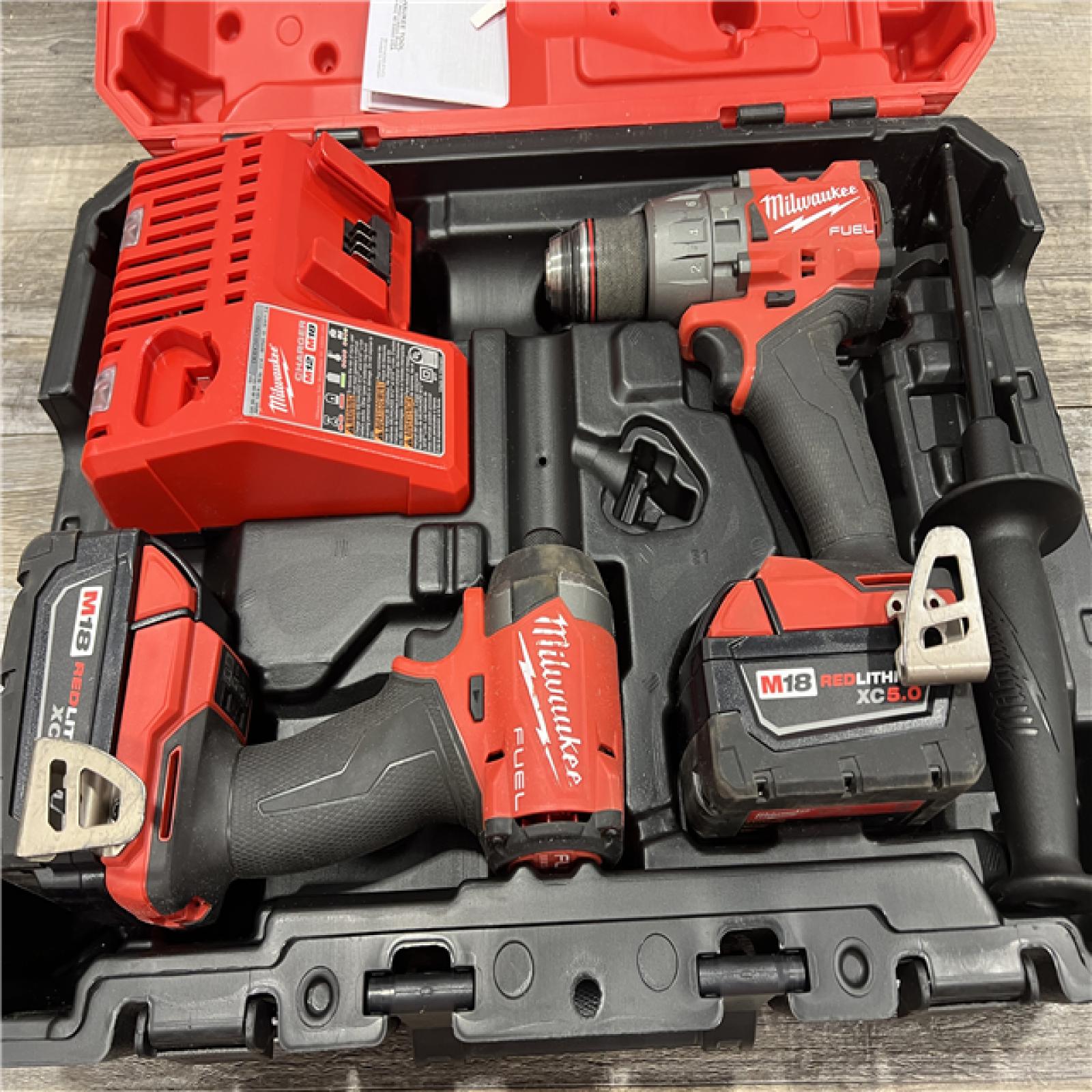 AS-IS MILWAUKEE M18 FUEL 18V Lithium-Ion Brushless Cordless Hammer Drill and Impact Driver Combo Kit (2-Tool) with 2 Batteries