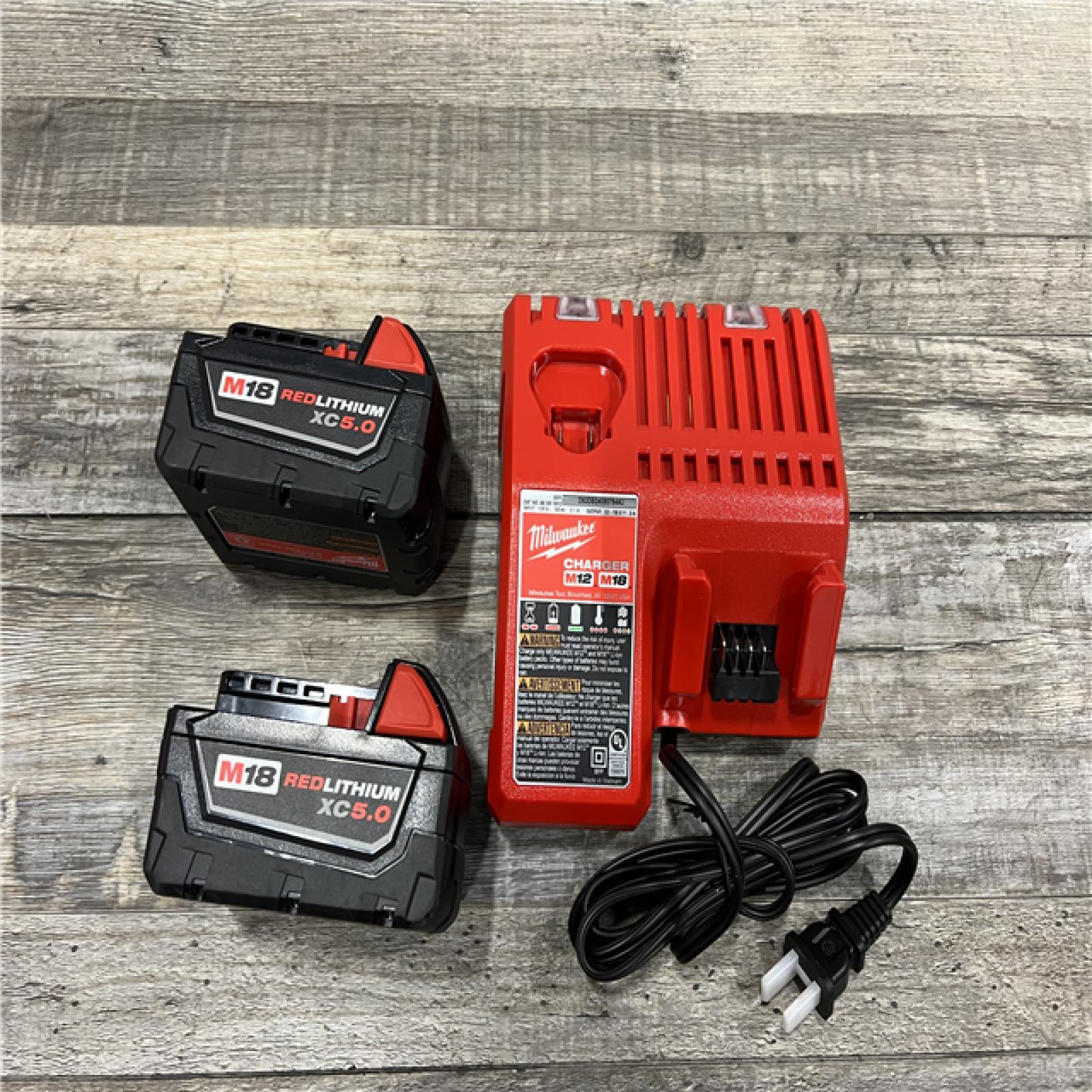 AS-IS Milwaukee M18 18-Volt Lithium-Ion XC Starter Kit with Two 5.0Ah Batteries / Charger (48-59-1852B)