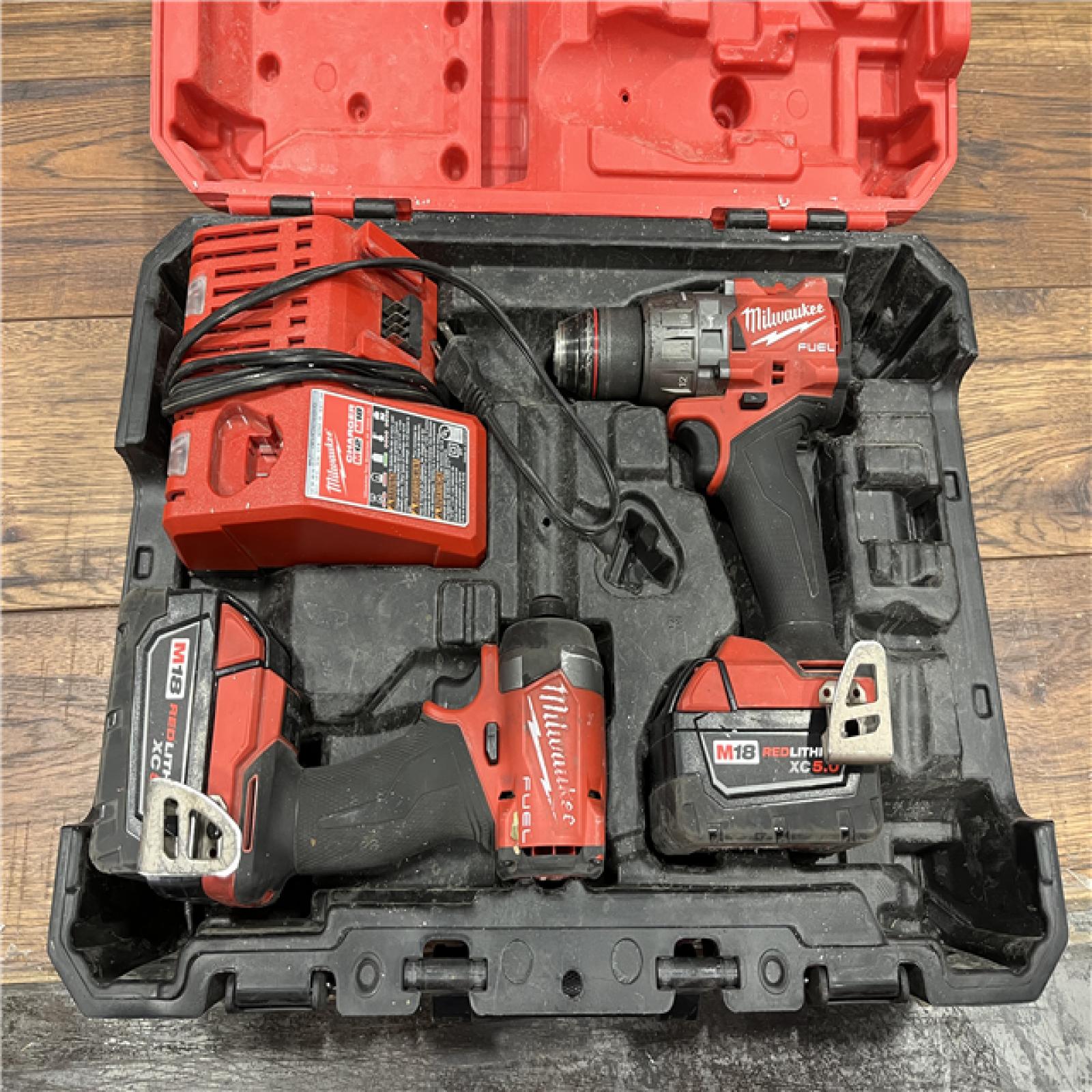 AS-IS Milwaukee M18 FUEL 18V Lithium-Ion Brushless Cordless Hammer Drill and Impact Driver Combo Kit (2-Tool) with 2 Batteries