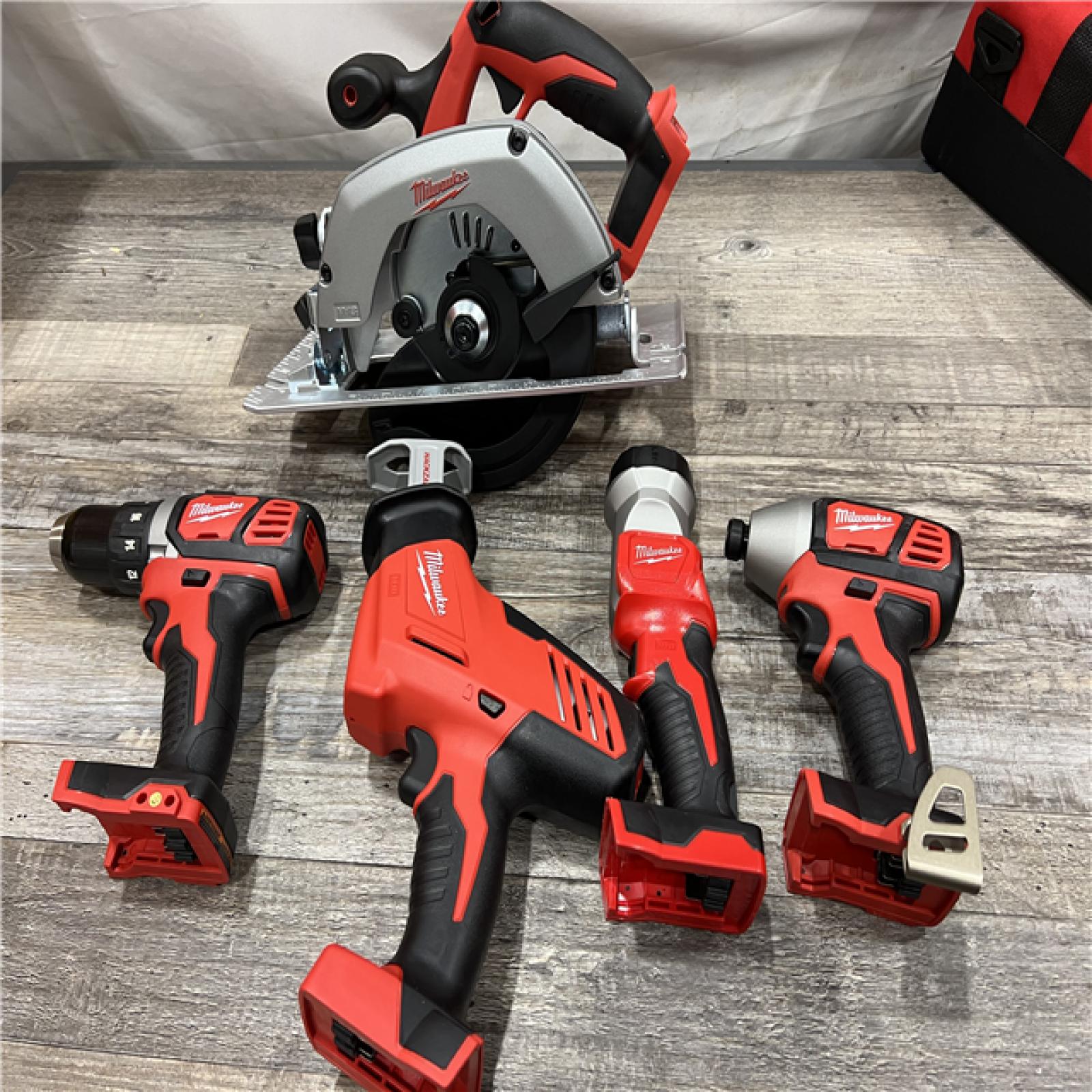 AS-IS MILWAUKEE M18 18V Lithium-Ion Cordless Combo Kit (5-Tool) with (1) 3.0Ah and (1) 1.5Ah Battery, (1) Charger, (1) Tool Bag