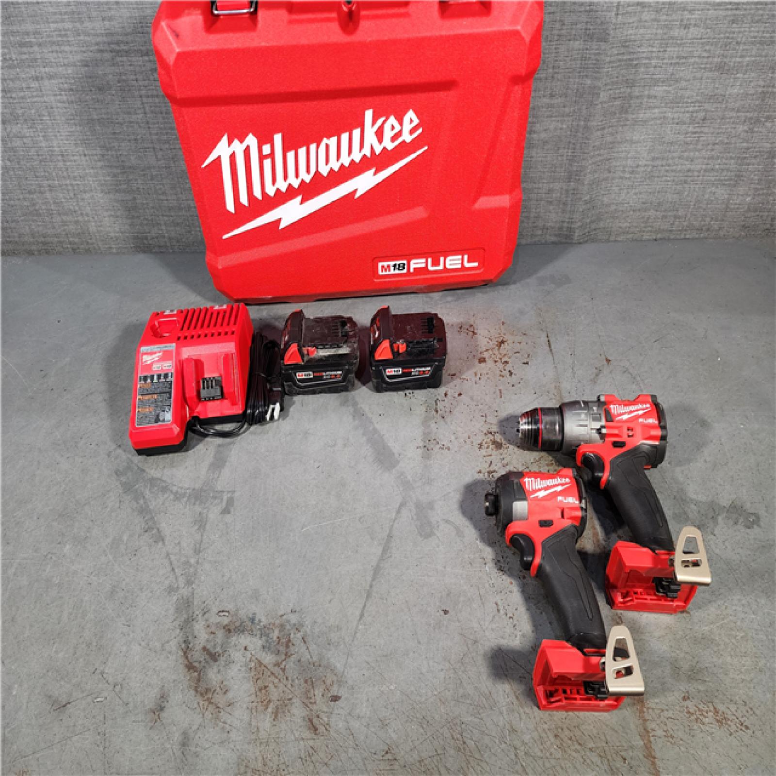 HOUSTON LOCATION - AS-IS Milwaukee M18 FUEL 18V Lithium-Ion Brushless Cordless Hammer Drill and Impact Driver Combo Kit (2-Tool) with 2 Batteries