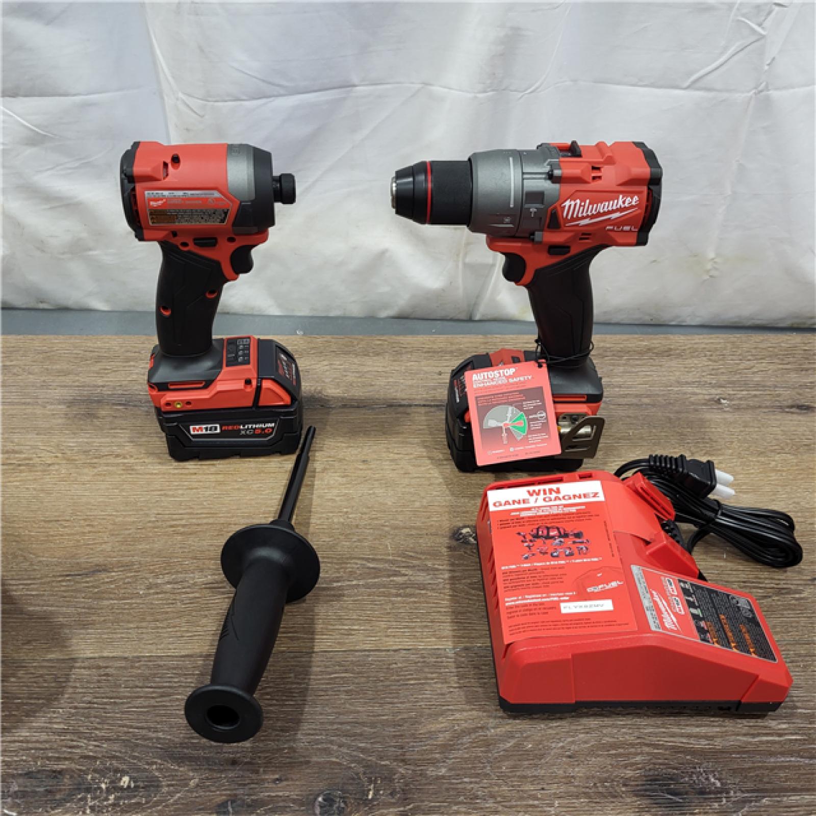 New AS-IS Milwaukee M18 FUEL 18V Lithium-Ion Brushless Cordless Hammer Drill and Impact Driver Combo Kit (2-Tool) with 2 Batteries