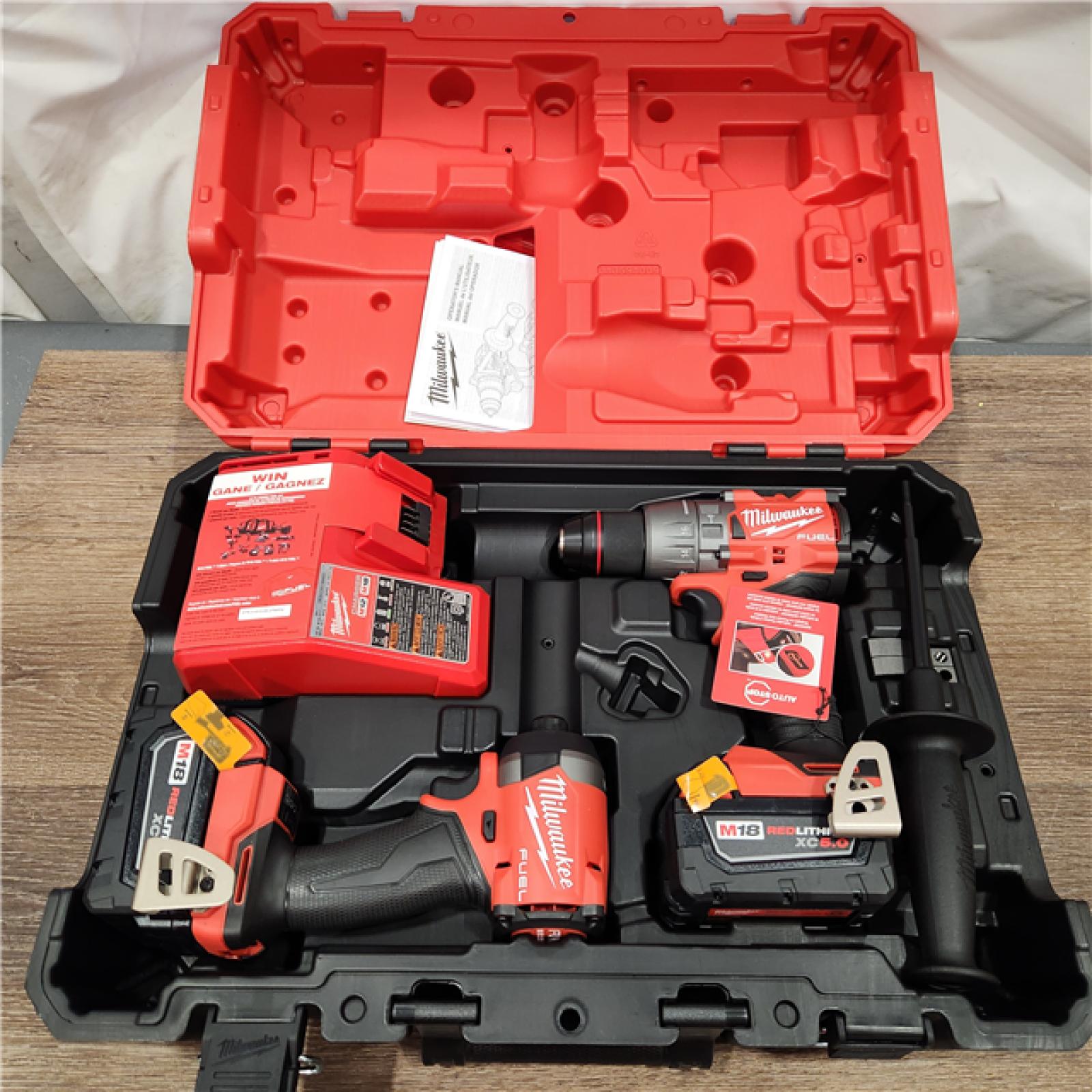 AS-IS Milwaukee M18 FUEL 18V Lithium-Ion Brushless Cordless Hammer Drill and Impact Driver Combo Kit (2-Tool) with 2 Batteries