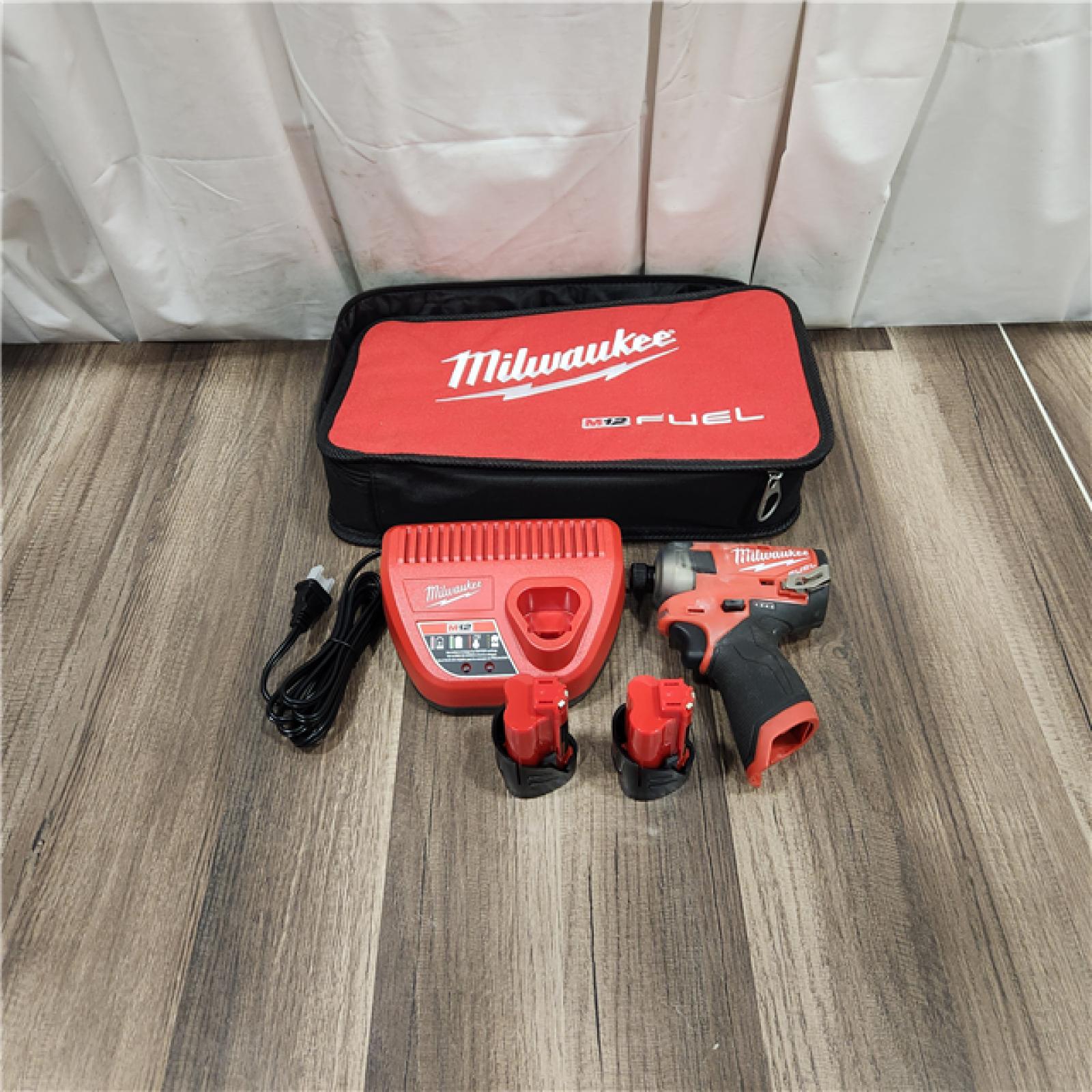 AS IS M12 FUEL SURGE 12V Lithium-Ion Brushless Cordless 1/4 in. Hex Impact Driver Compact Kit W/Two 2.0Ah Batteries, Bag