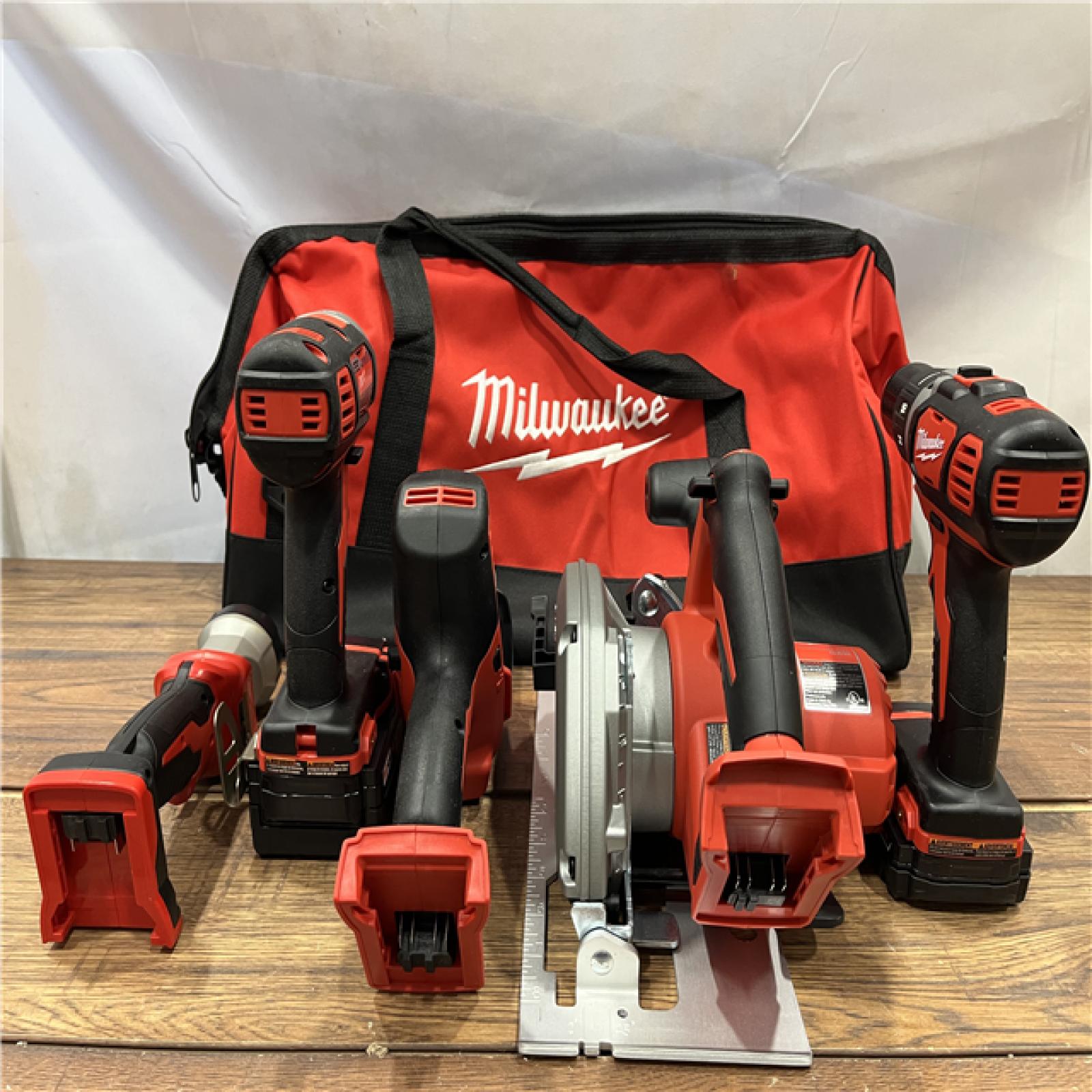 AS IS Milwaukee M18 18-Volt Lithium-Ion Cordless Combo Tool Kit (5-Tool) with (1) 3.0Ah and (1) 1.5Ah Battery, (1) Charger, (1) Tool Bag