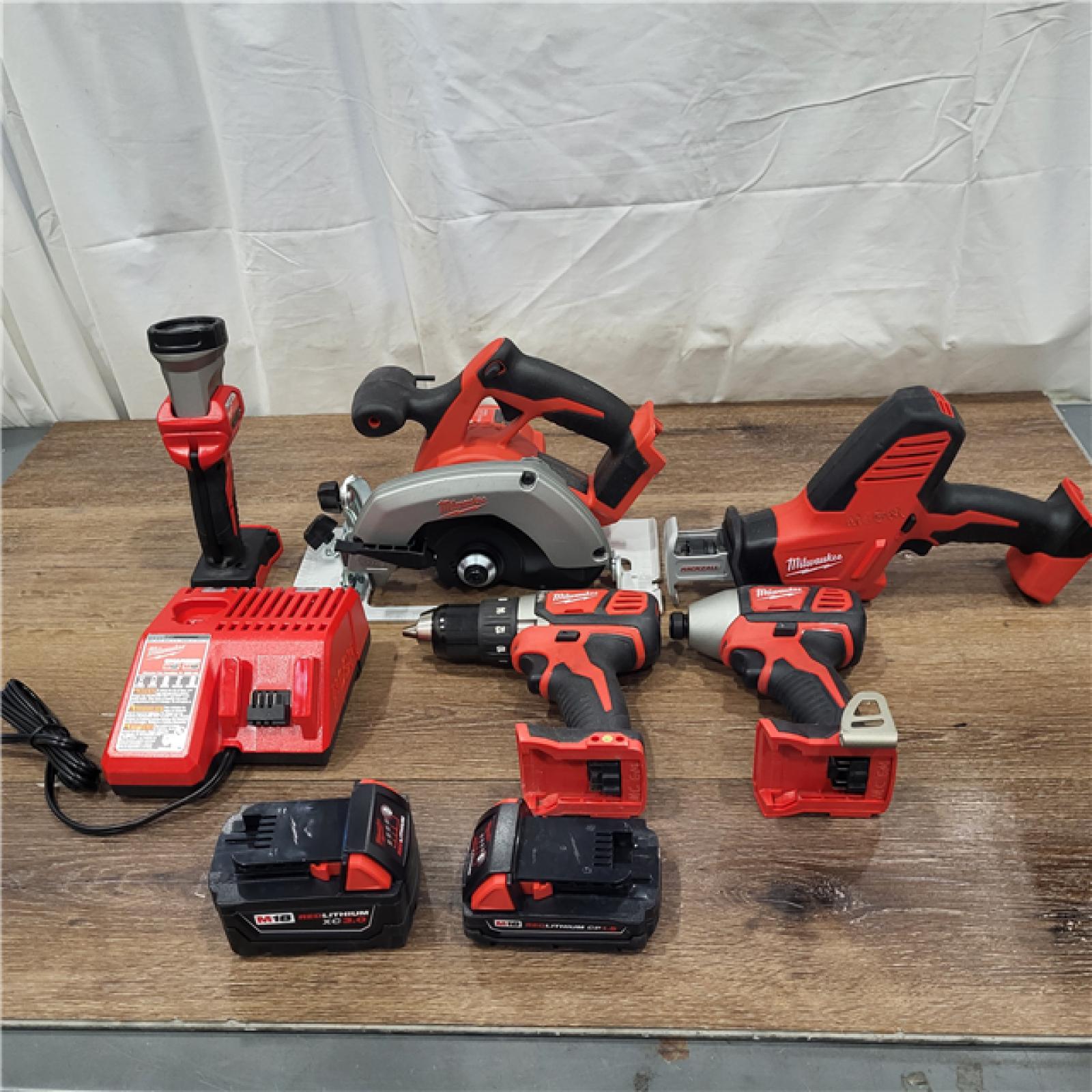 AS-IS Milwaukee M18 18-Volt Lithium-Ion Cordless Combo Tool Kit (5-Tool) with (1) 3.0Ah and (1) 1.5Ah Battery, (1) Charger, (1) Tool Bag