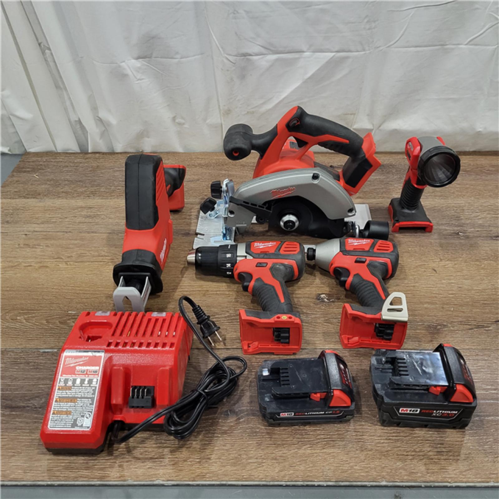 AS-IS Milwaukee M18 18-Volt Lithium-Ion Cordless Combo Tool Kit (5-Tool) with (1) 3.0Ah and (1) 1.5Ah Battery, (1) Charger, (1) Tool Bag