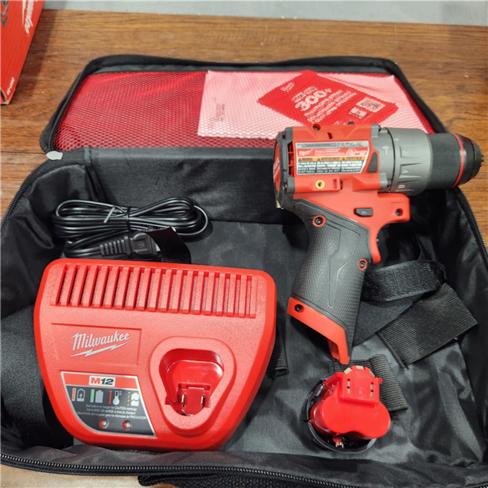 AS-IS Milwaukee M12 FUEL 12-Volt Lithium-Ion Brushless Cordless 1/2 in. Hammer Drill Kit with 1 Compact 2.0Ah Battery Pack and 1 Charger