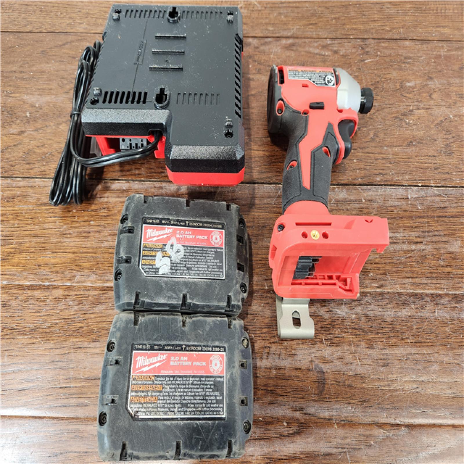 AS-IS Milwaukee M18 Lithium-Ion Brushless Cordless 1/4 in. Impact Driver Kit