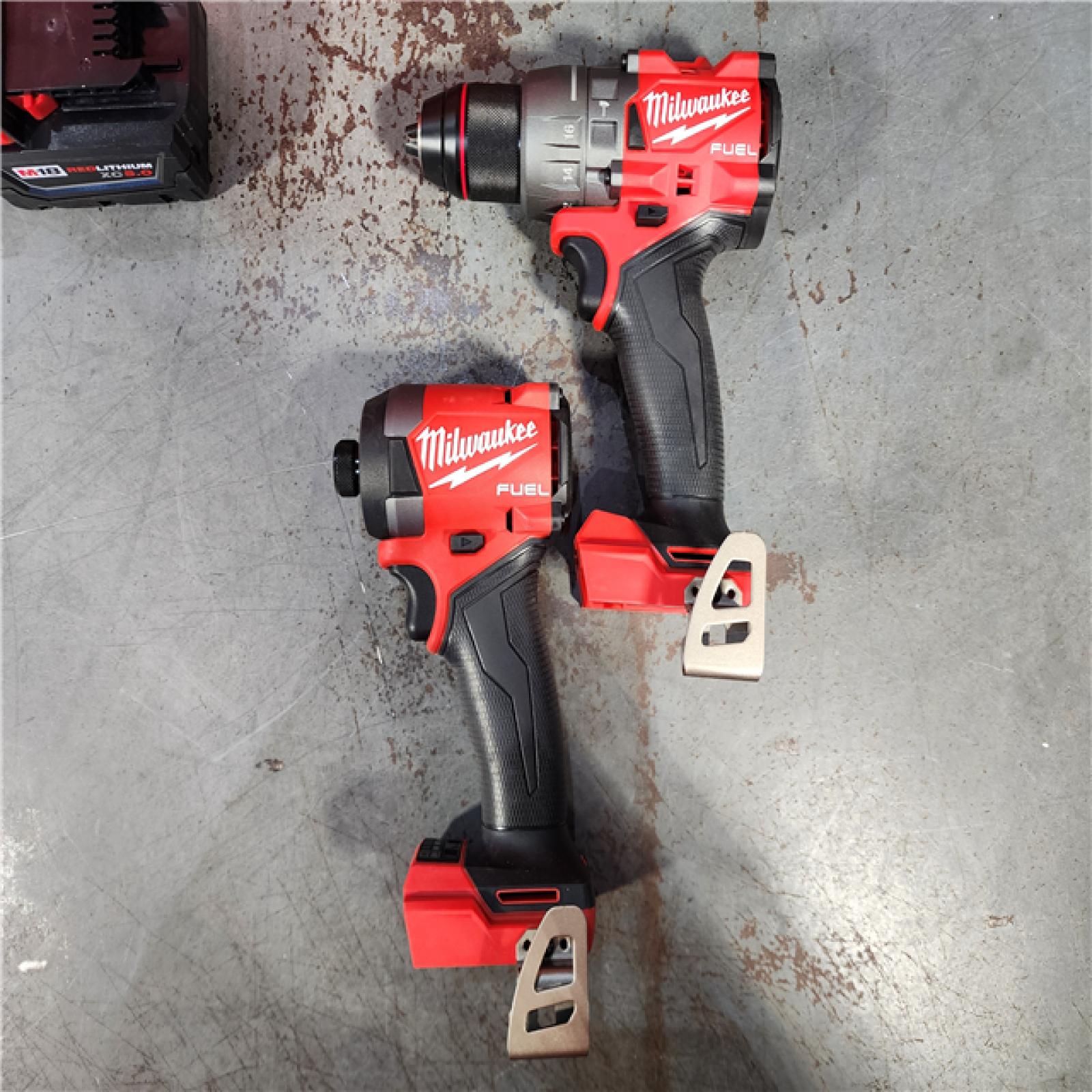 HOUSTON LOCATION - AS-IS (APPEARS LIKE NEW) Milwaukee M18 FUEL 18V Lithium-Ion Brushless Cordless Hammer Drill and Impact Driver Combo Kit (2-Tool) with 2 Batteries