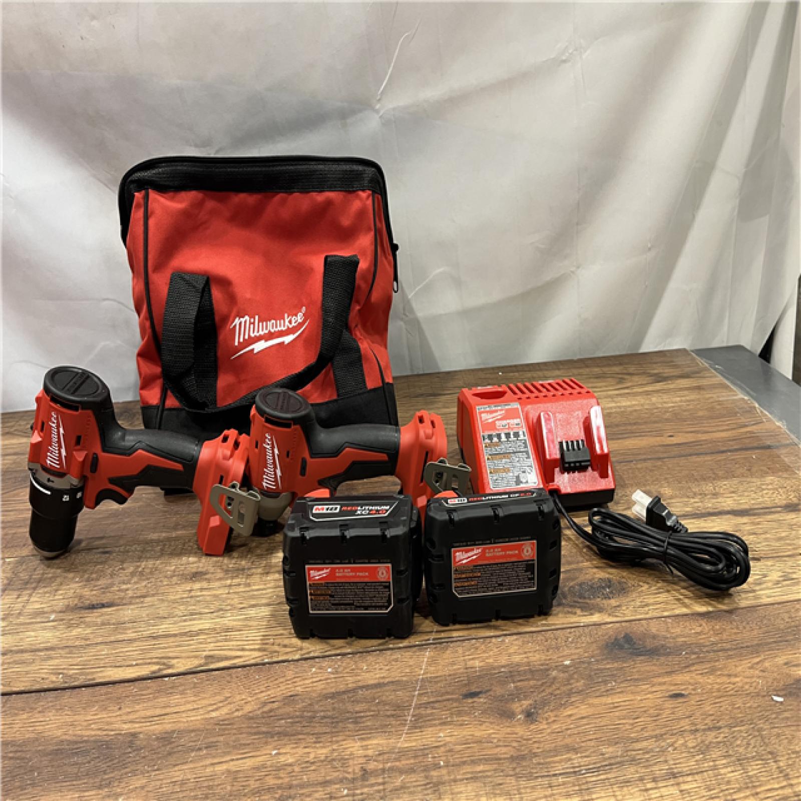 AS-IS M18 18-Volt Lithium-Ion Brushless Cordless Compact Hammer Drill/Impact Combo Kit (2-Tool) with (2) Batteries, Bag