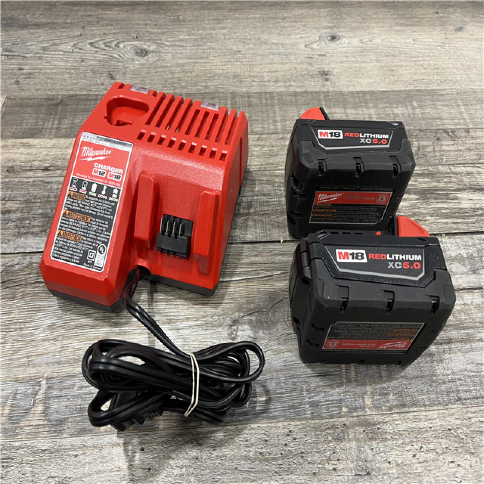 AS-IS Milwaukee M18 18-Volt Lithium-Ion XC Starter Kit with Two 5.0Ah Batteries / Charger (48-59-1852B)