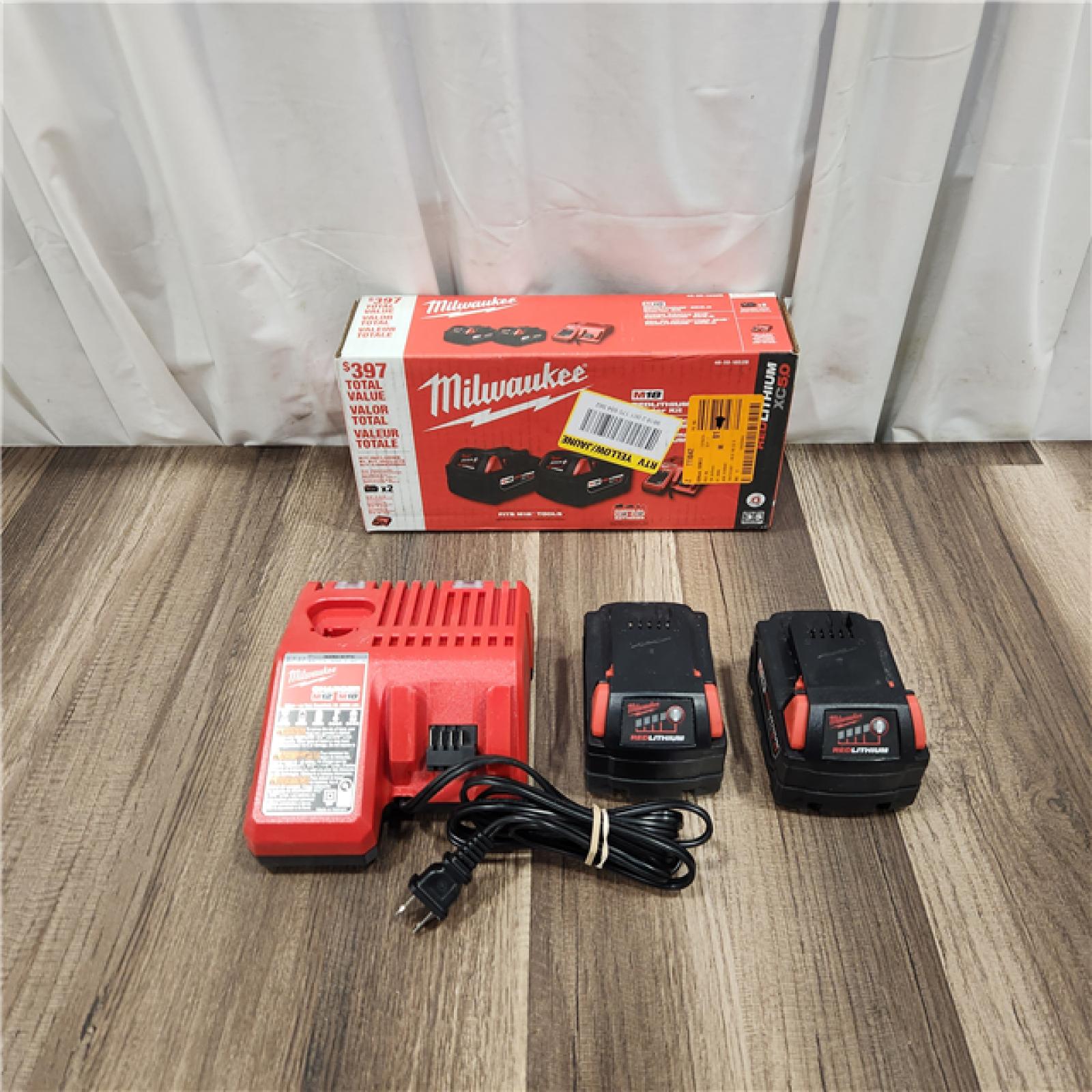 AS IS M18 18-Volt Lithium-Ion XC Starter Kit with Two 5.0Ah Batteries and Charger