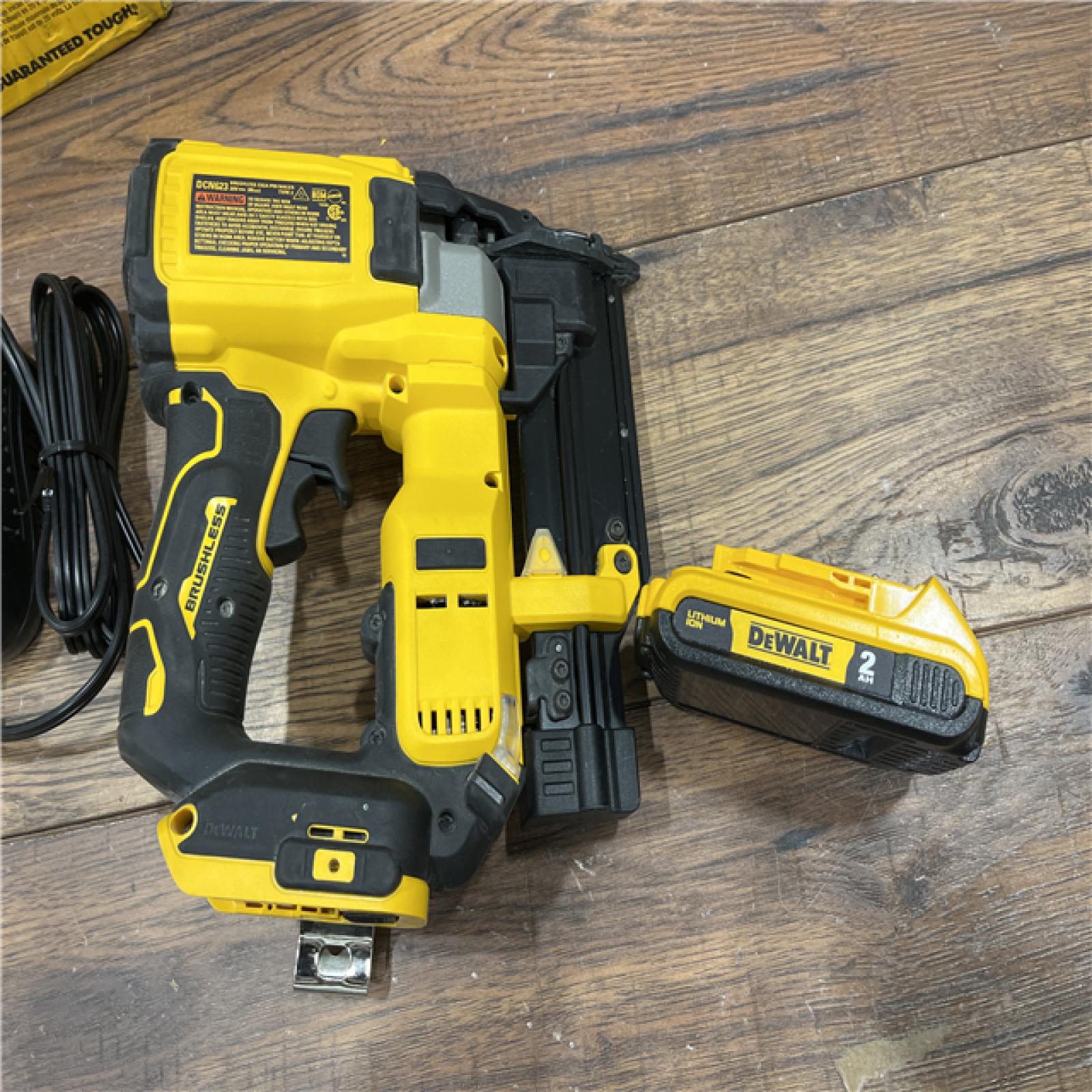 AS-IS DEWALT ATOMIC 20V MAX Lithium Ion Cordless 23 Gauge Pin Nailer Kit with 2.0Ah Battery and Charger