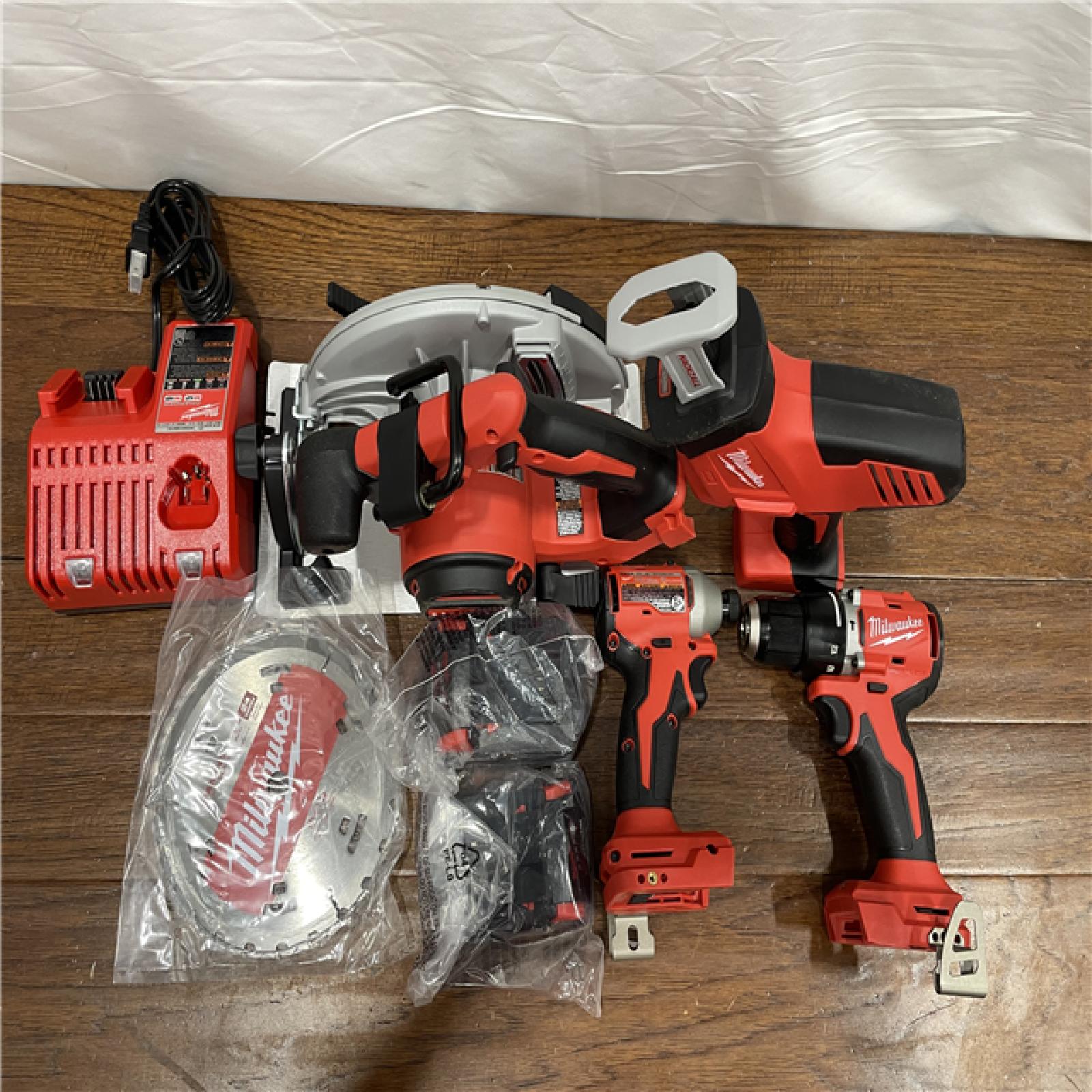 AS-IS M18 18-Volt Lithium-Ion Brushless Cordless Combo Kit (4-Tool) with 2-Batteries, 1-Charger and Tool Bag