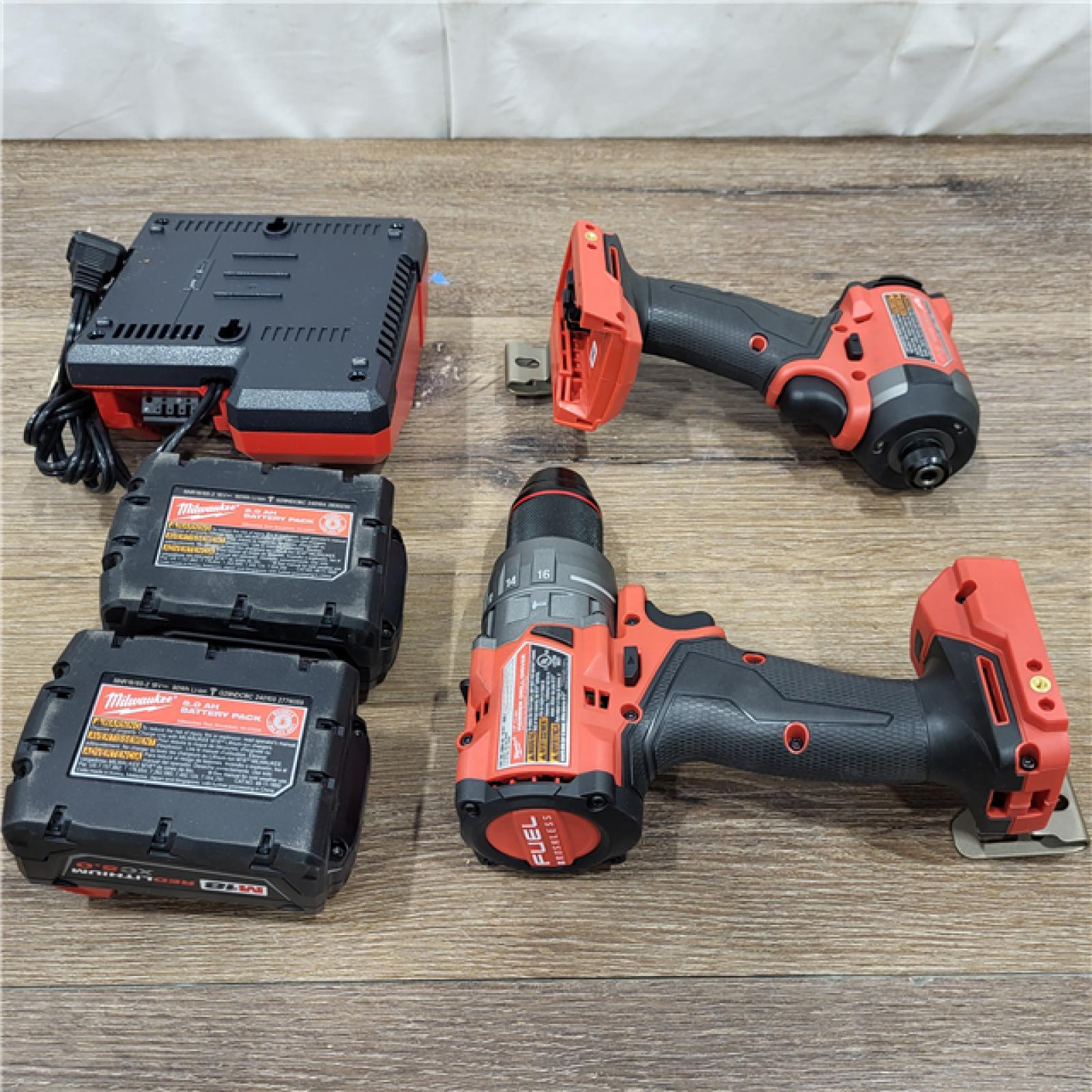 AS-IS Milwaukee M18 FUEL 18V Lithium-Ion Brushless Cordless Hammer Drill and Impact Driver Combo Kit (2-Tool) with 2 Batteries