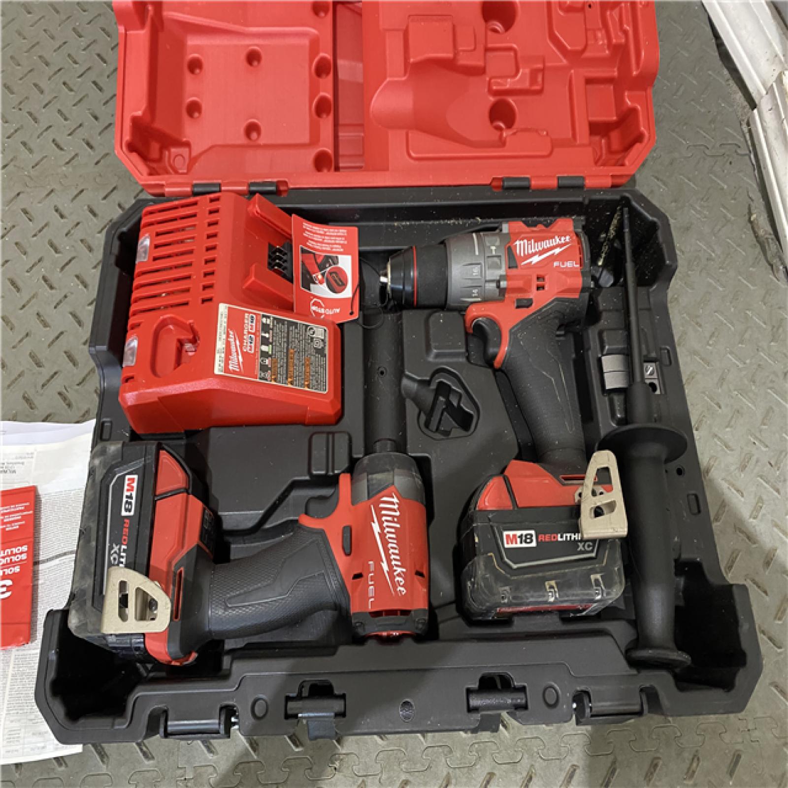 Houston location AS-IS Milwaukee 3697-22 M18 FUEL 1/2 Hammer Driller/Driver &1/4 Hex Impact Driver 2 Tool Combo Kit