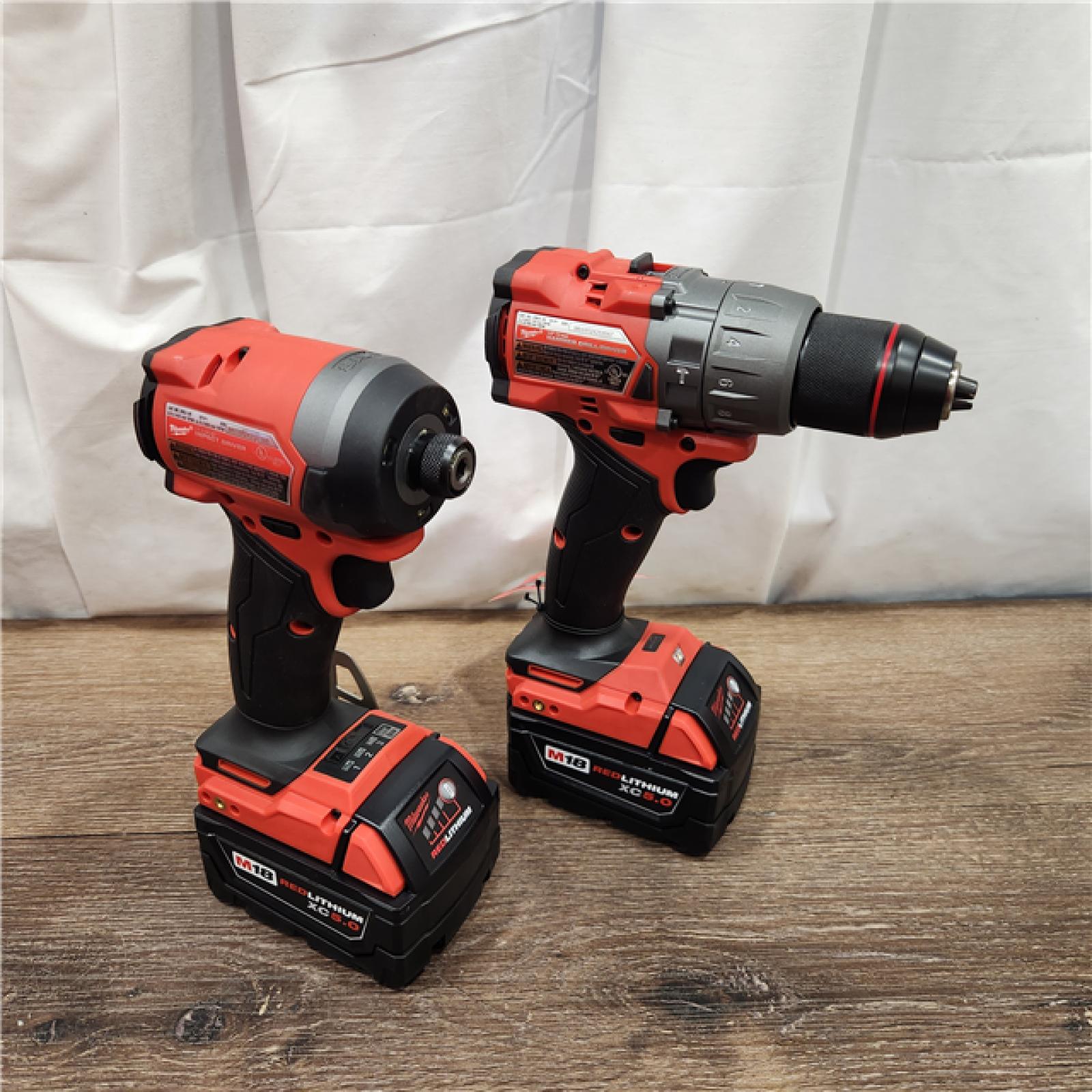 AS-IS Milwaukee M18 FUEL 18V Lithium-Ion Brushless Cordless Hammer Drill and Impact Driver Combo Kit (2-Tool) with 2 Batteries