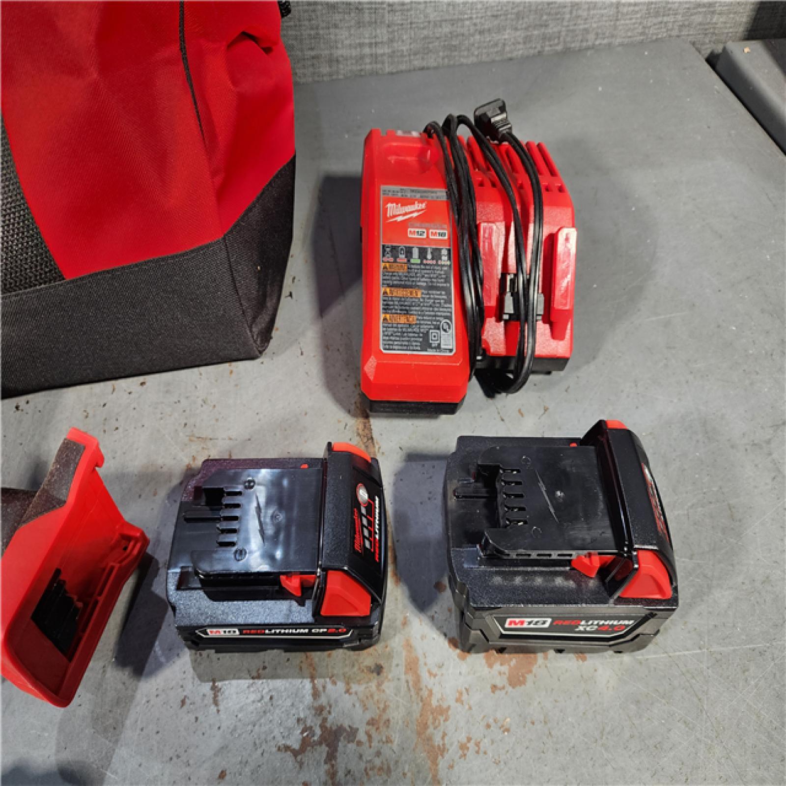 HOUSTON LOCATION - AS-IS Milwaukee M18 18-Volt Lithium-Ion Brushless Cordless Combo Kit (4-Tool) with 2-Batteries, 1-Charger and Tool Bag