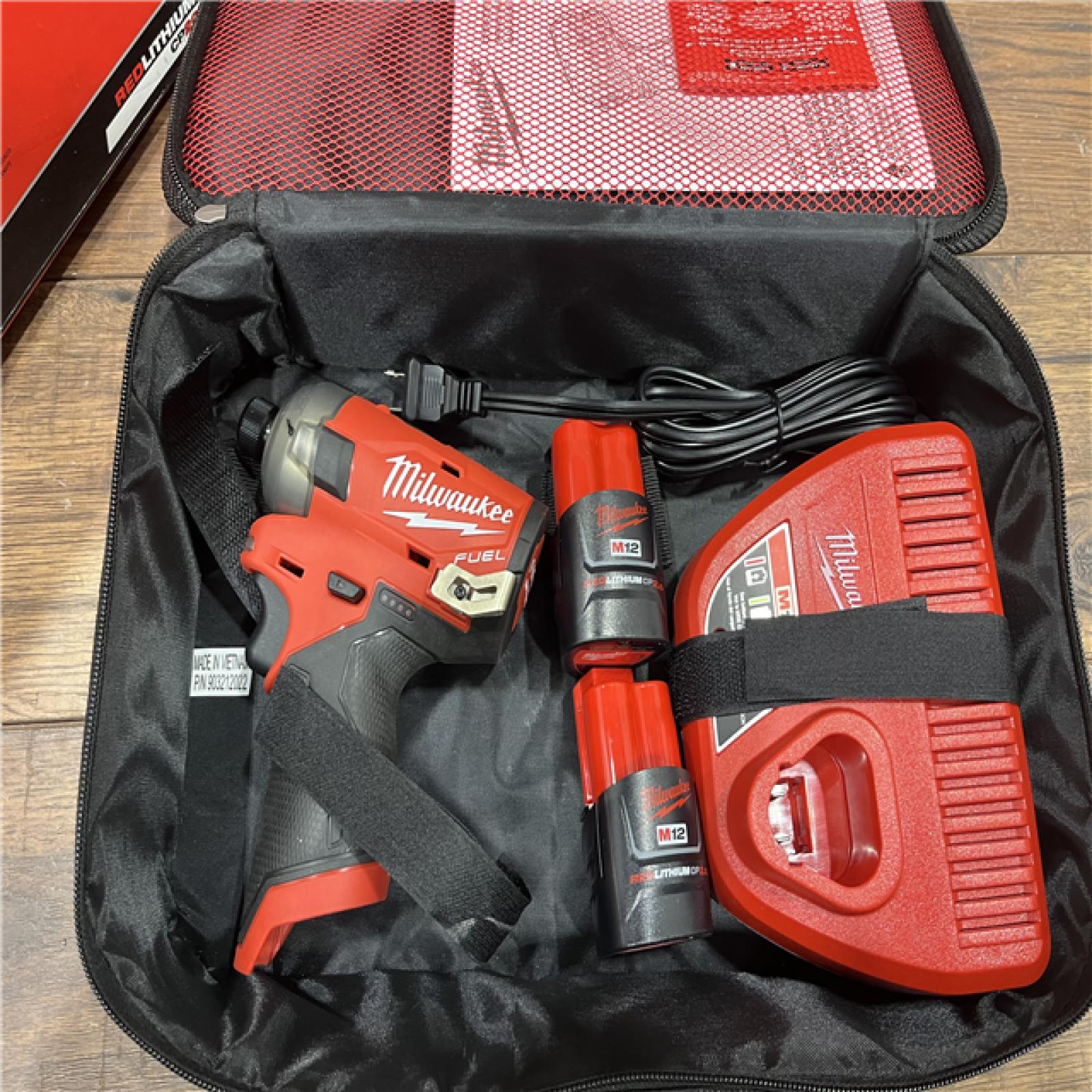 AS-IS M12 FUEL SURGE 12V Lithium-Ion Brushless Cordless 1/4 in. Hex Impact Driver Compact Kit W/Two 2.0Ah Batteries, Bag