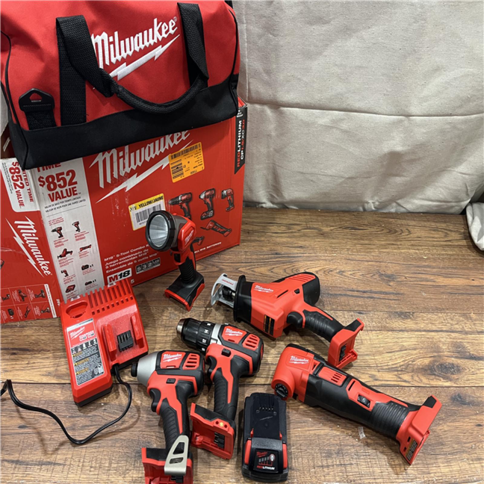 AS-IS Milwaukee M18 18V Lithium-Ion Cordless Combo Kit (5-Tool) with (2) Batteries, Charger and Tool Bag