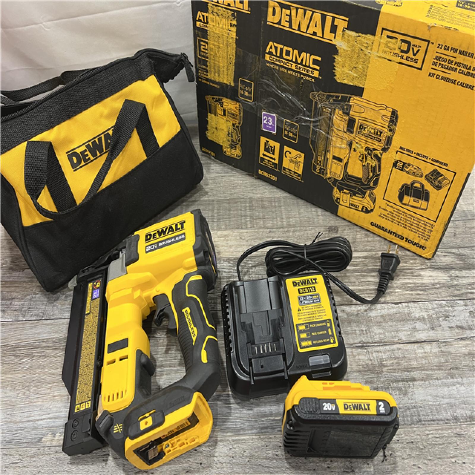 AS-IS DEWALT ATOMIC 20V MAX Lithium Ion Cordless 23 Gauge Pin Nailer Kit with 2.0Ah Battery and Charger